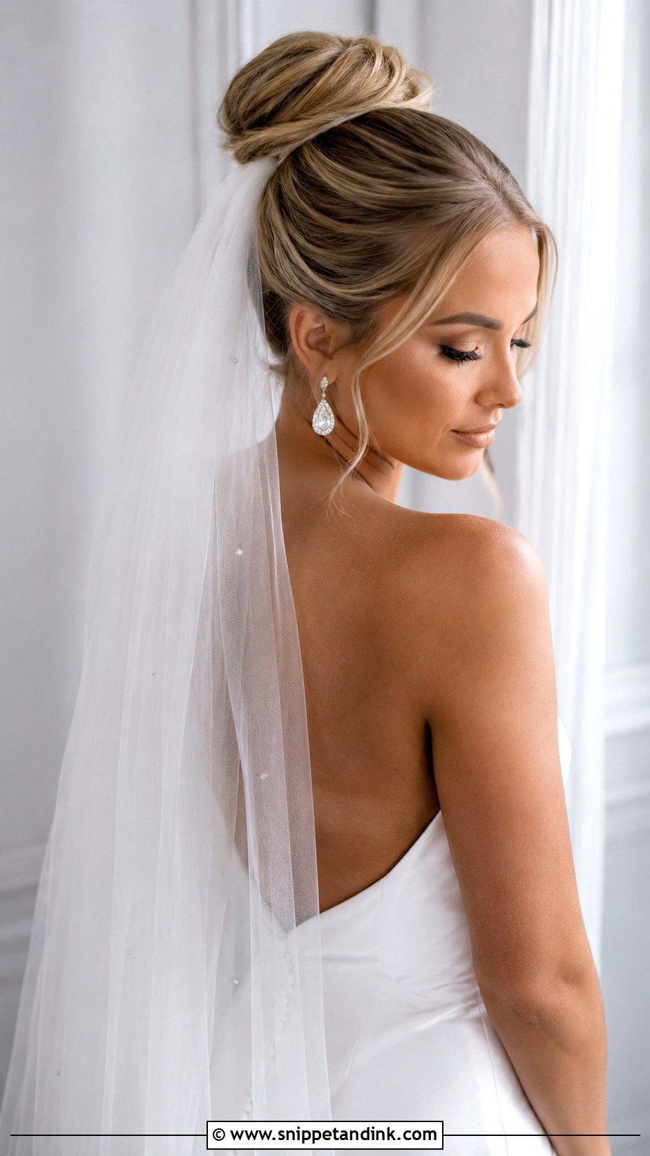 High Bun Updo With Drop Veil - Snippet and Ink - 25 Updo with Veil Ideas