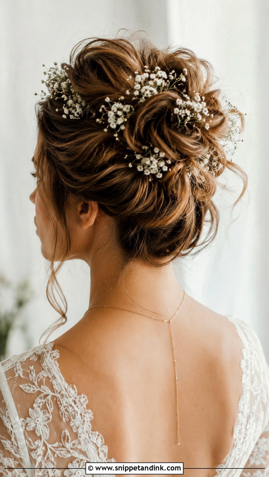 High Bun With Babys Breath - Snippet and Ink - 25 High Bun Wedding Ideas