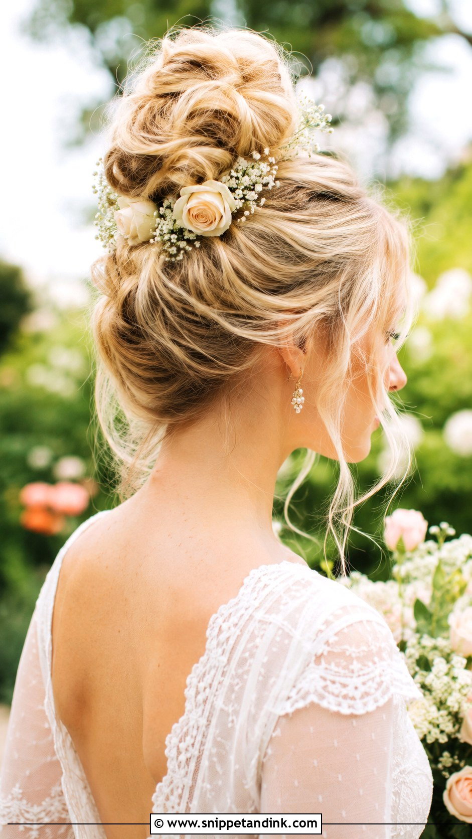 High Bun With Flowers Wedding Hairstyle - Snippet and Ink - 25 High Bun Wedding Hairstyles
