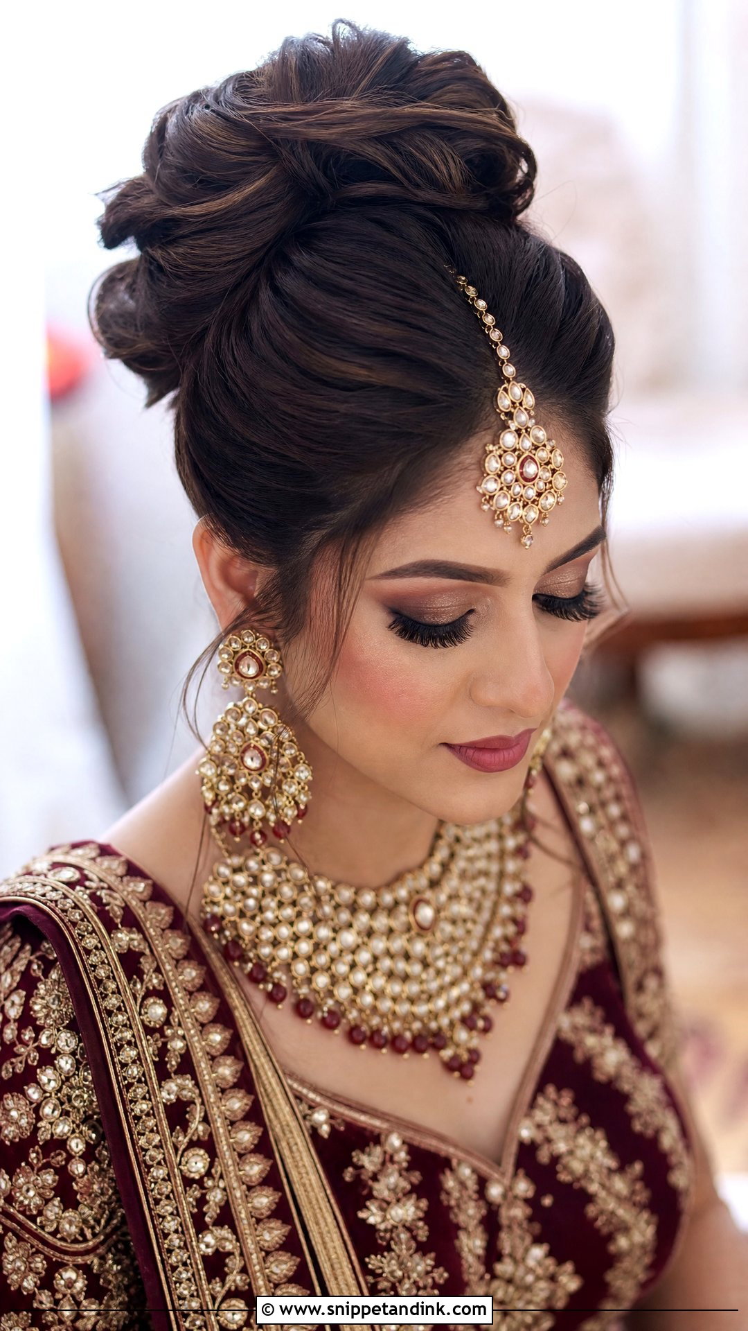 High Bun With Maang Tikka - Snippet and Ink - 20 Indian Wedding Bun Bridal Hairstyle Ideas