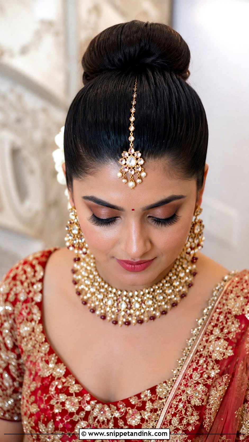 High Bun With Maang Tikka - Snippet and Ink - 20 Indian Wedding Hairstyles for Round Face