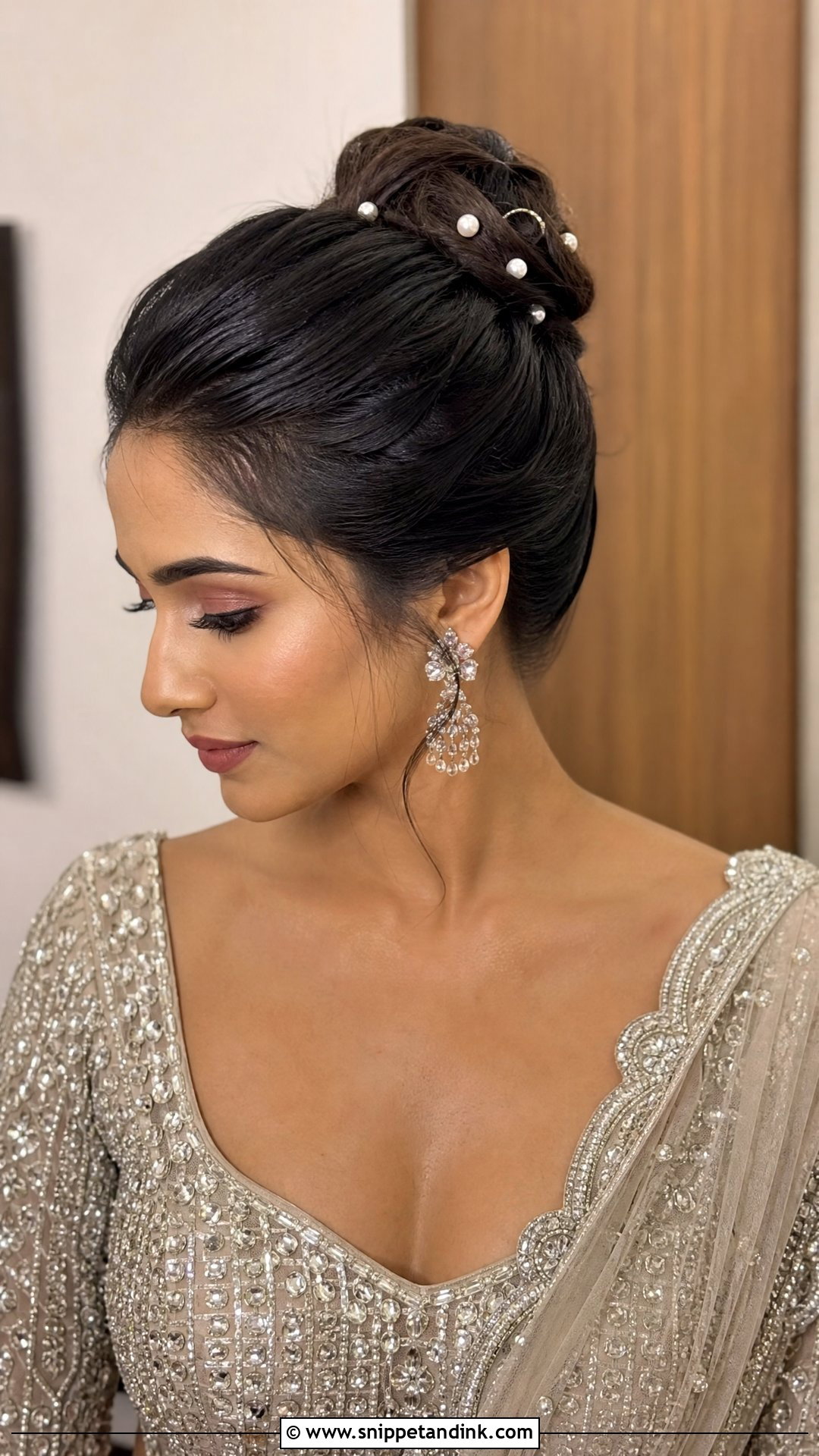 High Bun With Pearl Pins - Snippet and Ink - 20 Indian Wedding Bun Hairstyle Ideas