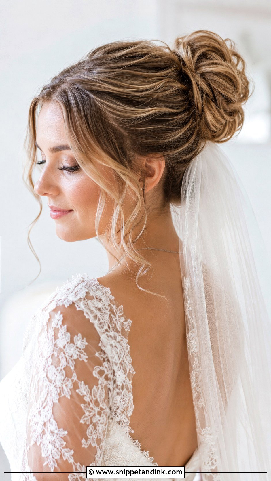 High Bun With Wispy Tendrils and Veil - Snippet and Ink - 25 High Bun Wedding Ideas