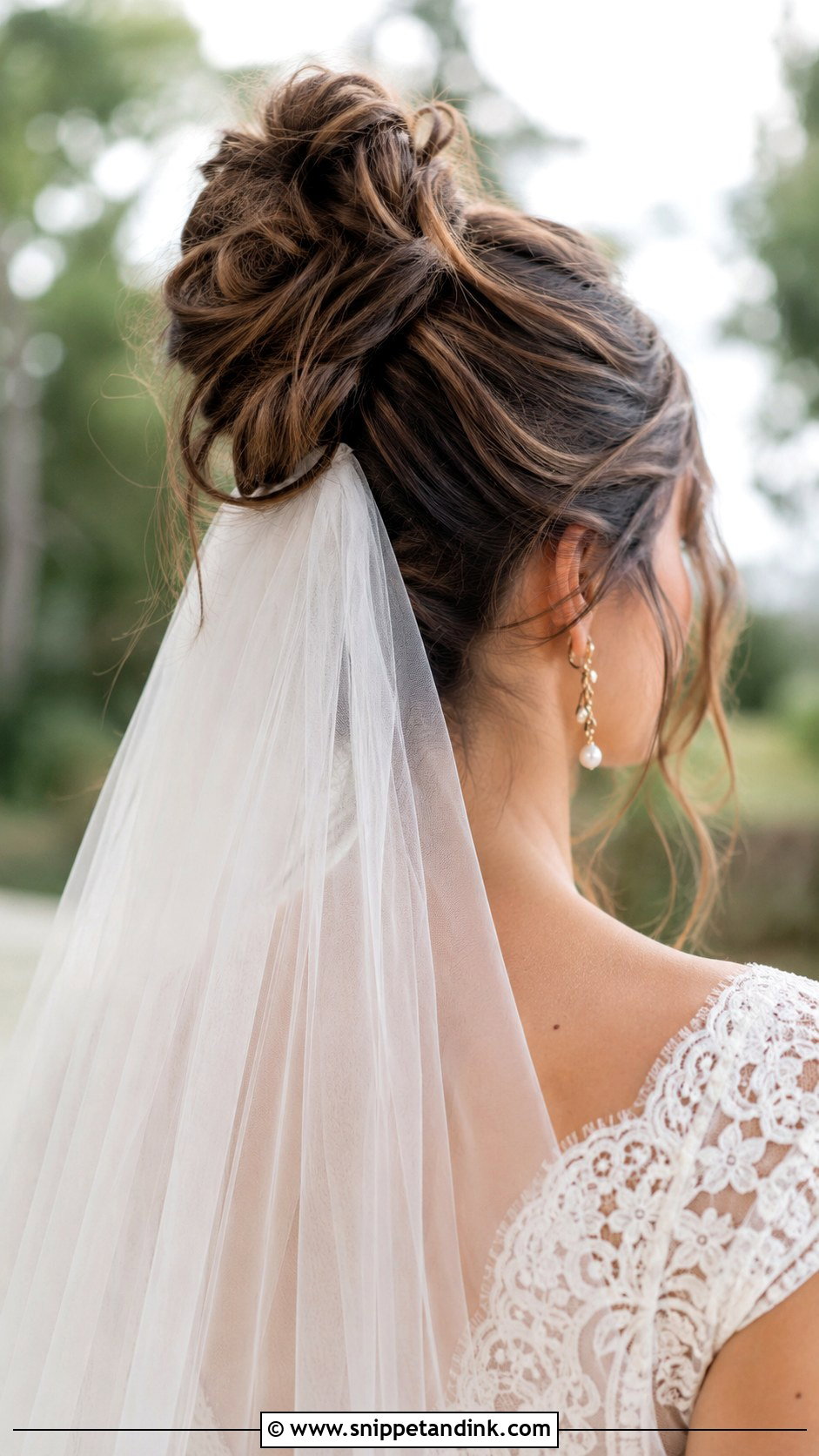 High Messy Bun With Veil Underneath - Snippet and Ink - 25 High Messy Bun Wedding Hair Ideas