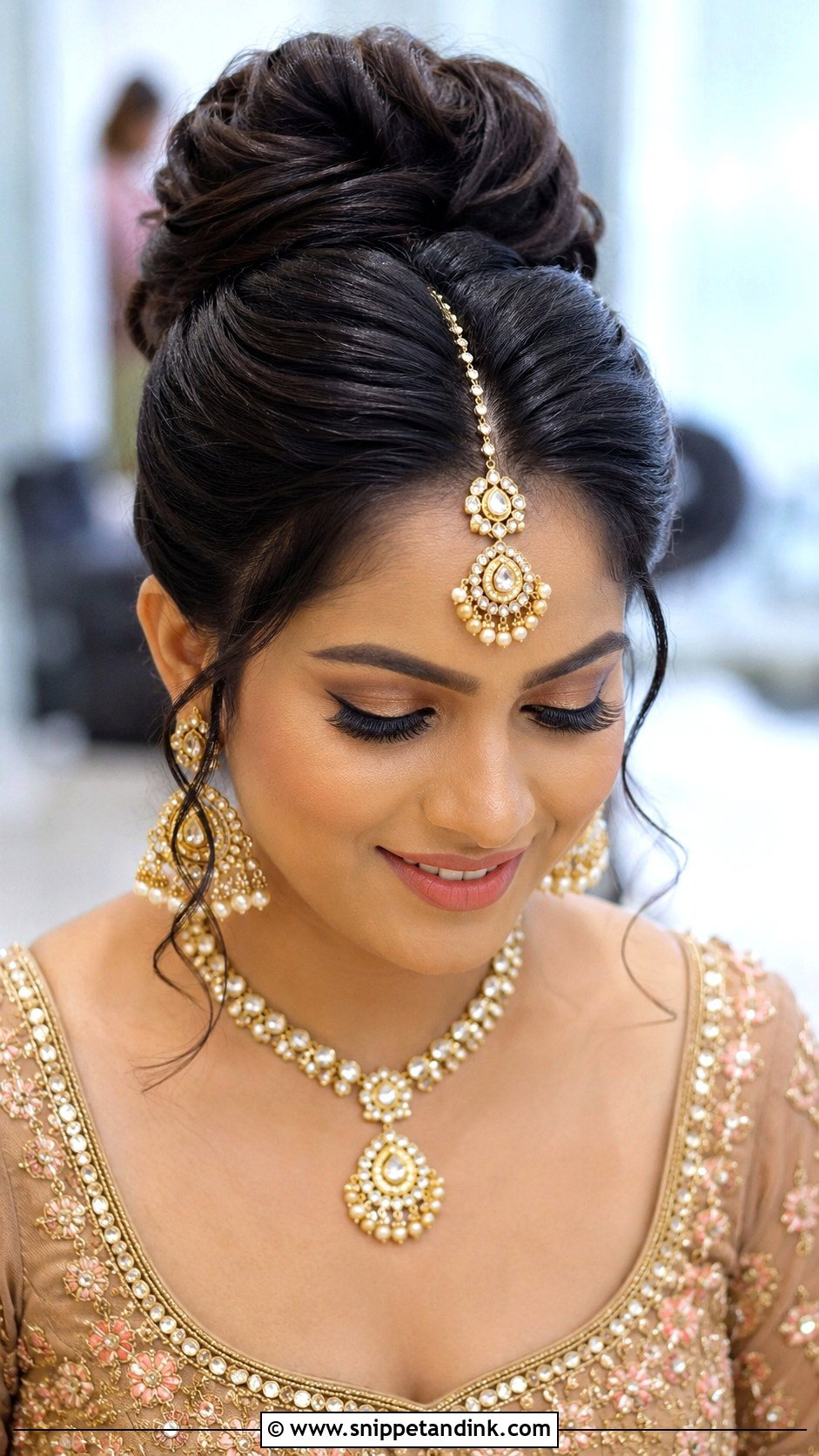 Indian Bridesmaid High Bun With Maang Tikka - Snippet and Ink - 25 Indian Hairstyles for Bridesmaids