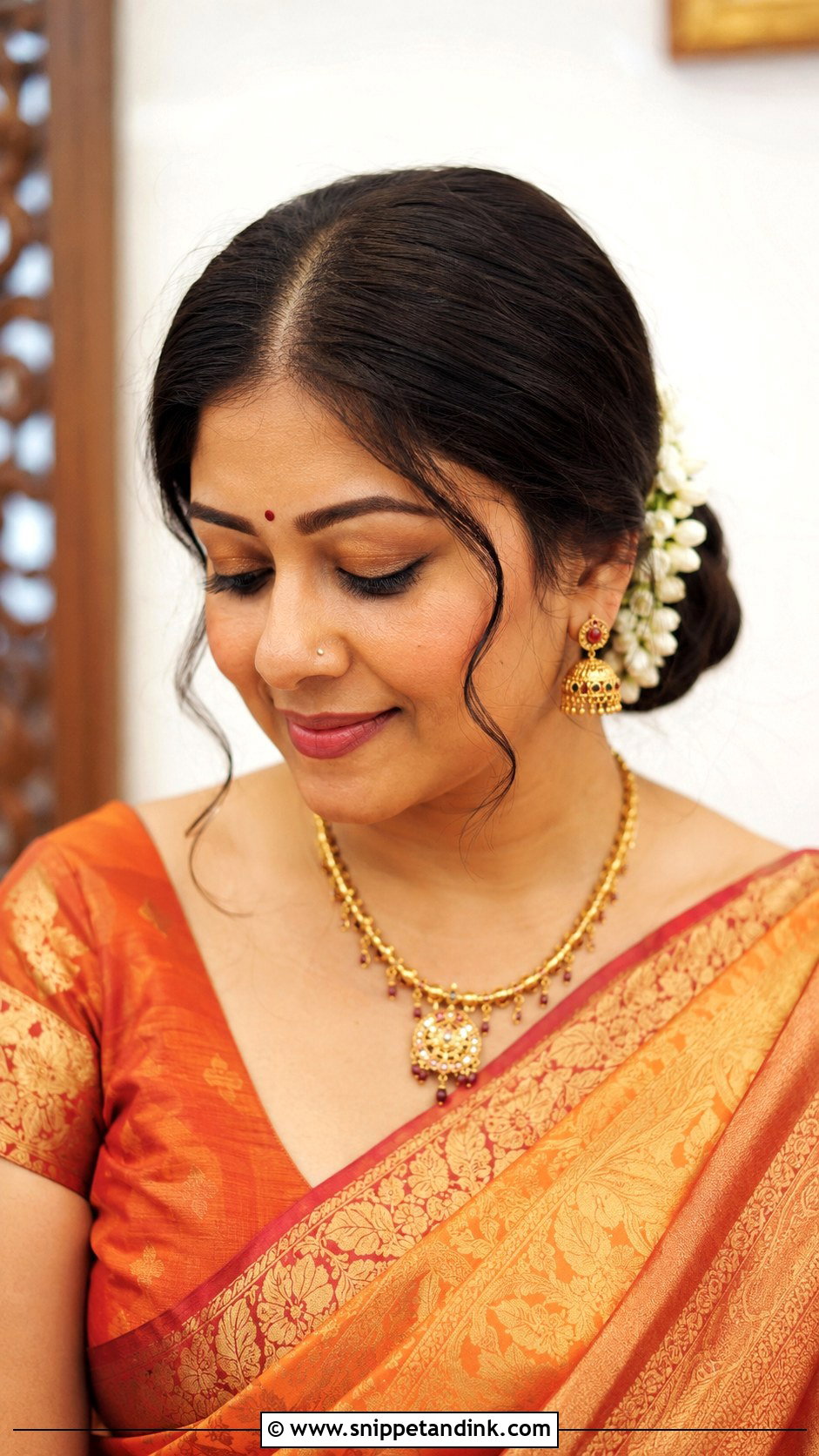 Indian Mother Center Part Bun - Snippet and Ink - 20 Indian Mother Hairstyles for Wedding