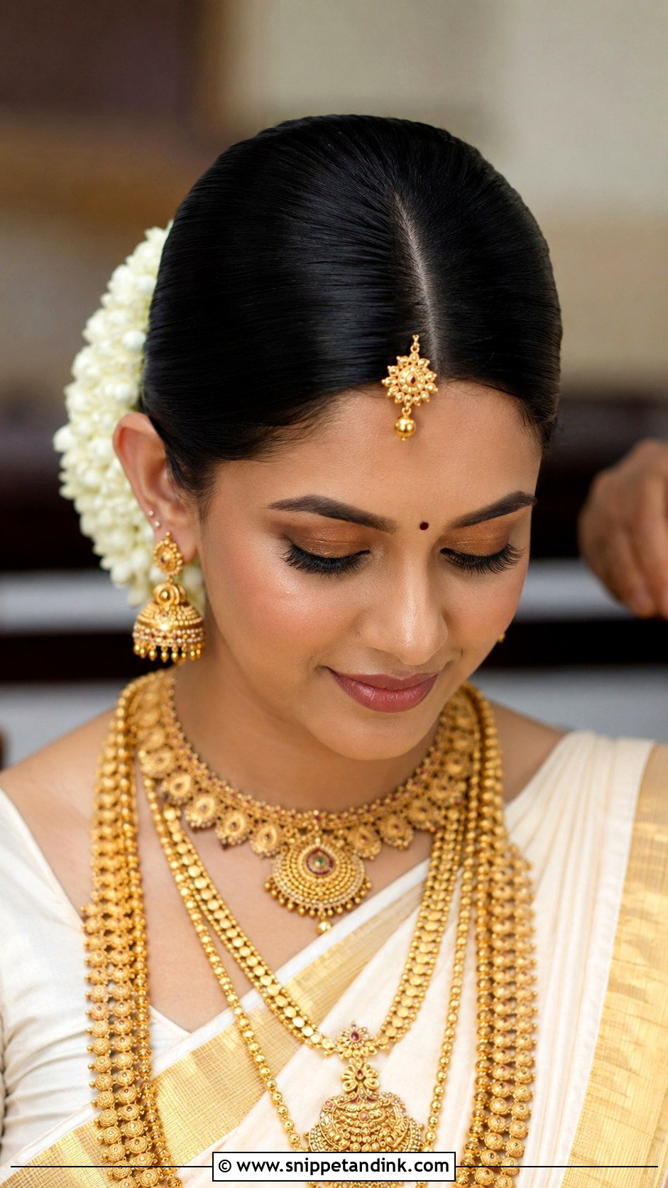 Kerala Bridal Sleek Center Part Bun - Snippet and Ink - 15 Kerala Wedding Bridal Hairstyle Ideas