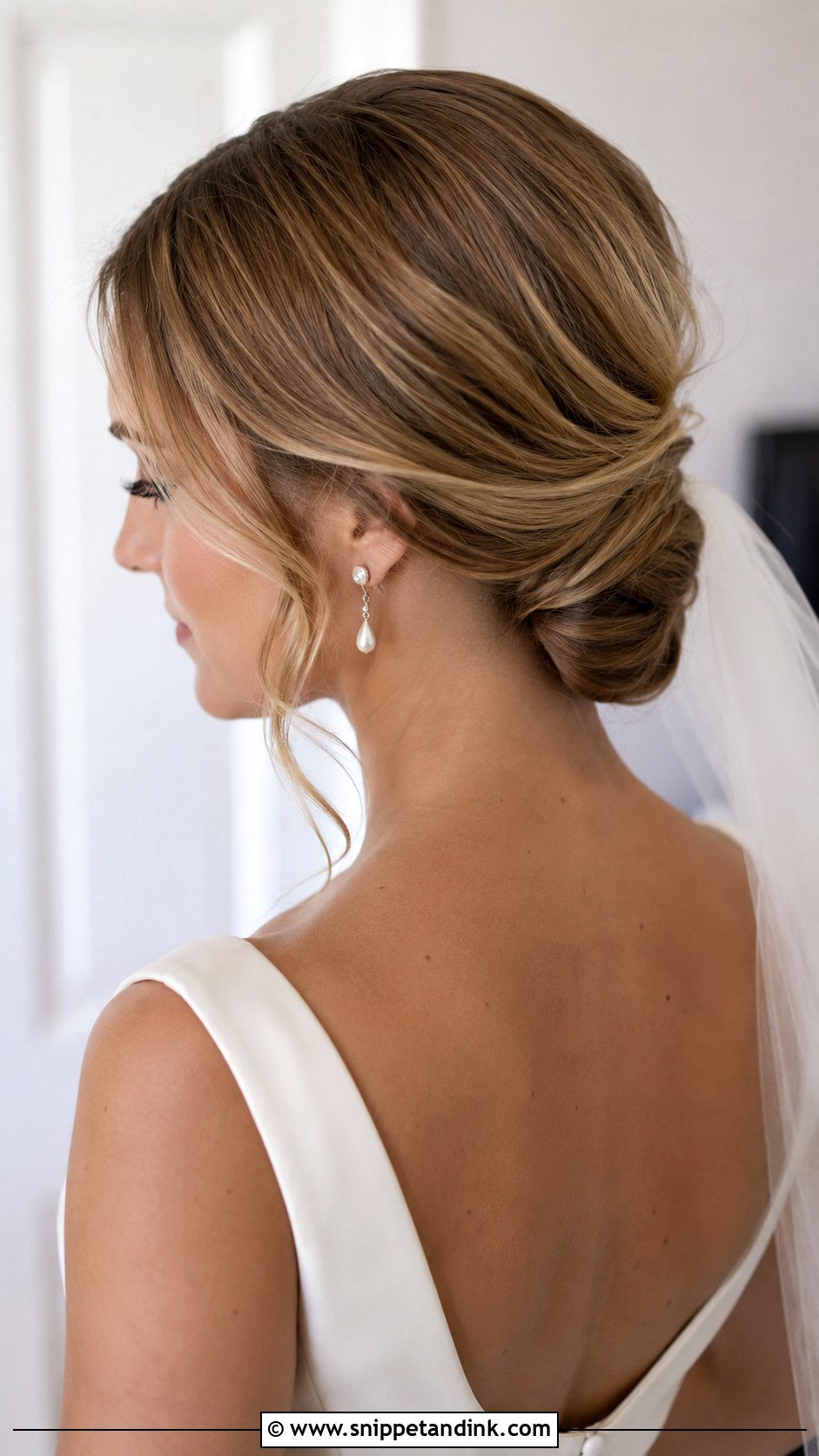 Long Bridal Low Bun - Snippet and Ink - 20 Long Bride Hair Ideas