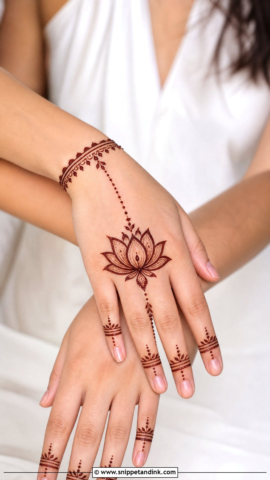 Lotus Back Hand Chain Mehndi Design - Snippet and Ink - 30 Minimal Lotus Mehndi Design Ideas