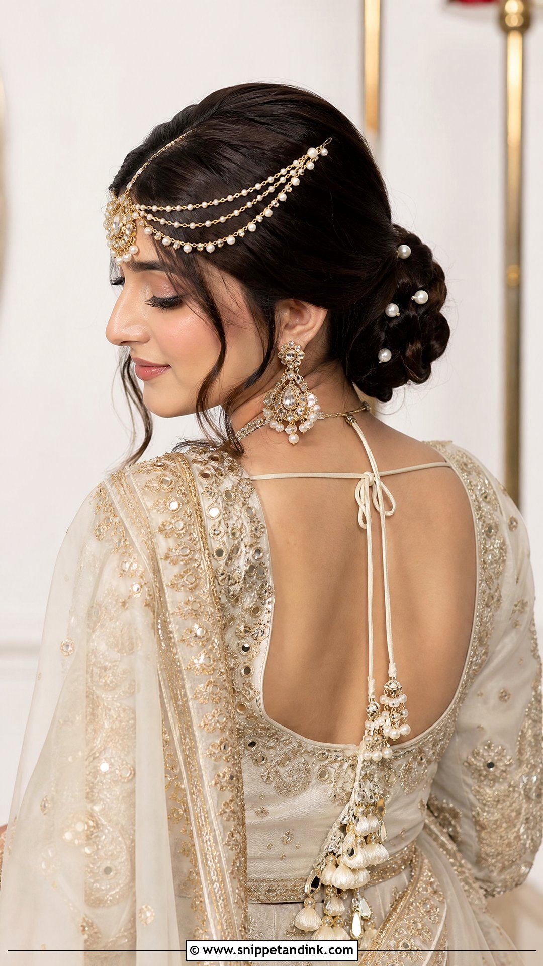 Low Bridal Bun With Matha Patti - Snippet and Ink - 15 Bridal Hairstyles with Matha Patti