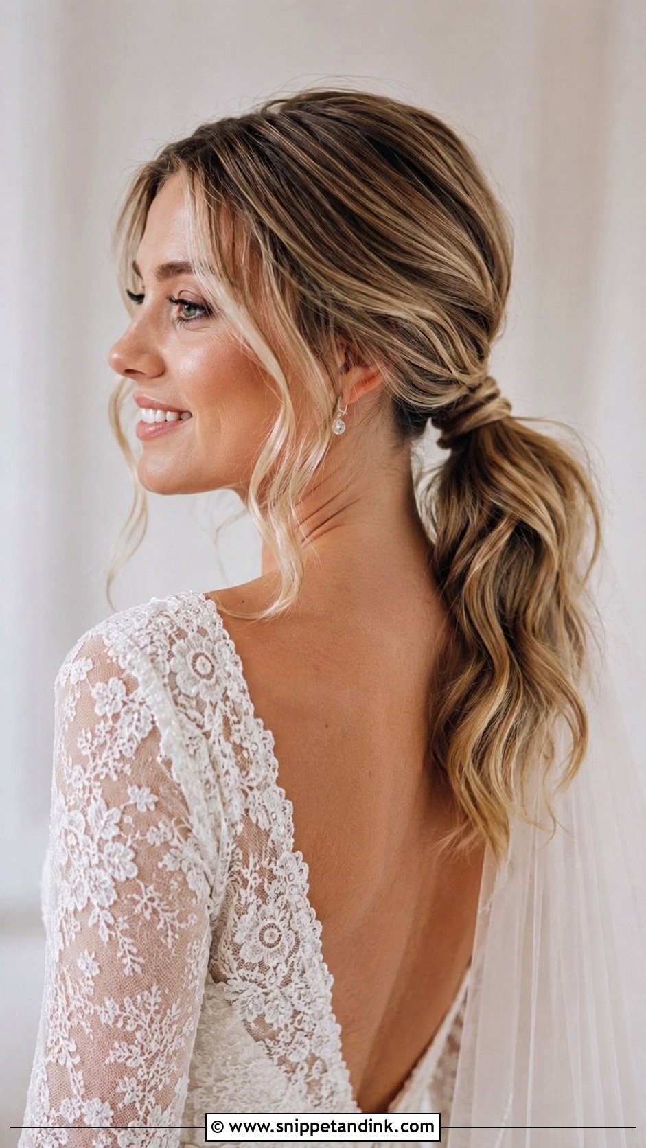 Low Bridal Ponytail With Soft Waves - Snippet and Ink - 20 Pony Updo Wedding Ideas