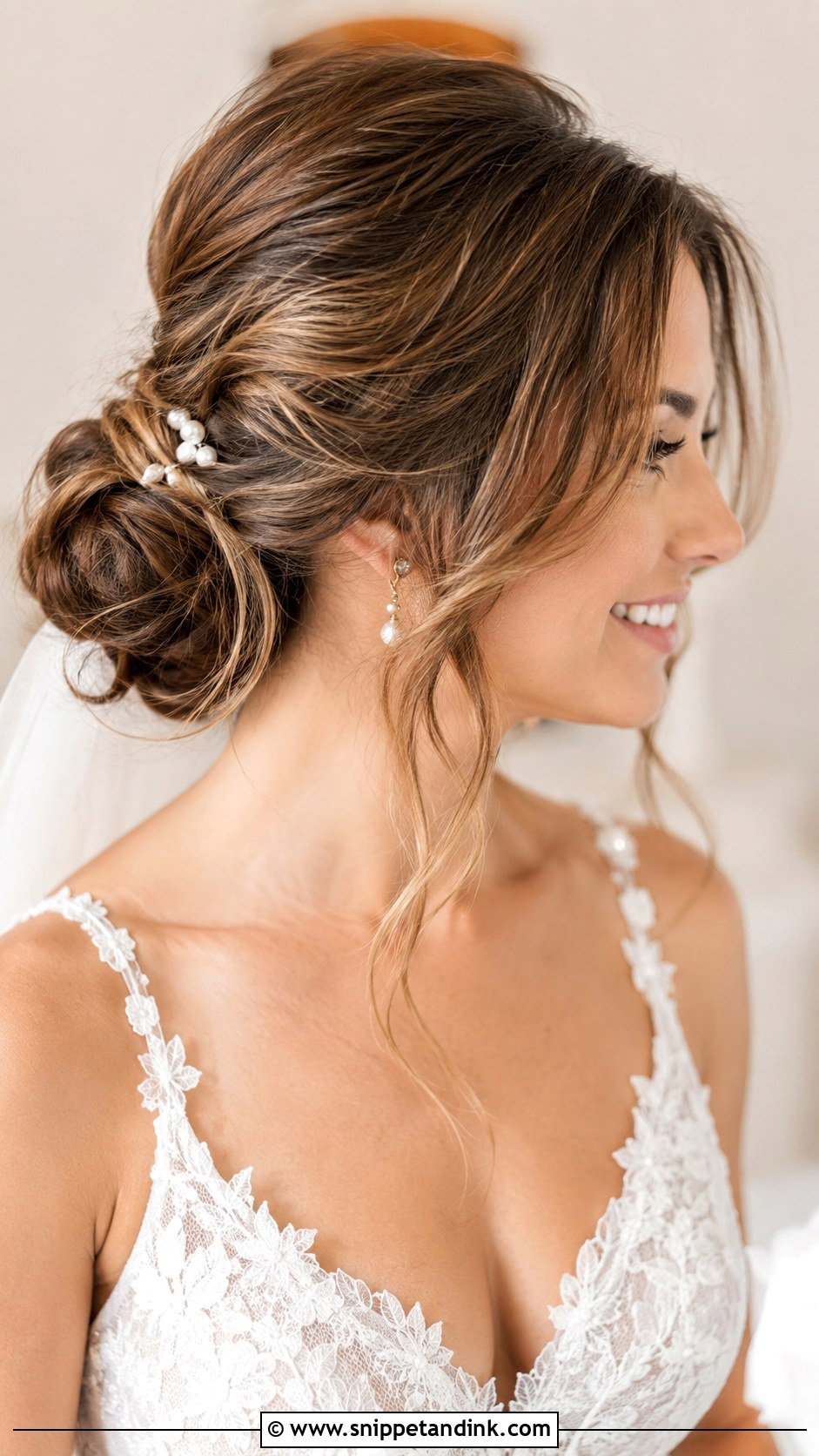 Low Bun Updo With Curtain Bangs - Snippet and Ink - 20 Wedding Updo with Bangs Ideas