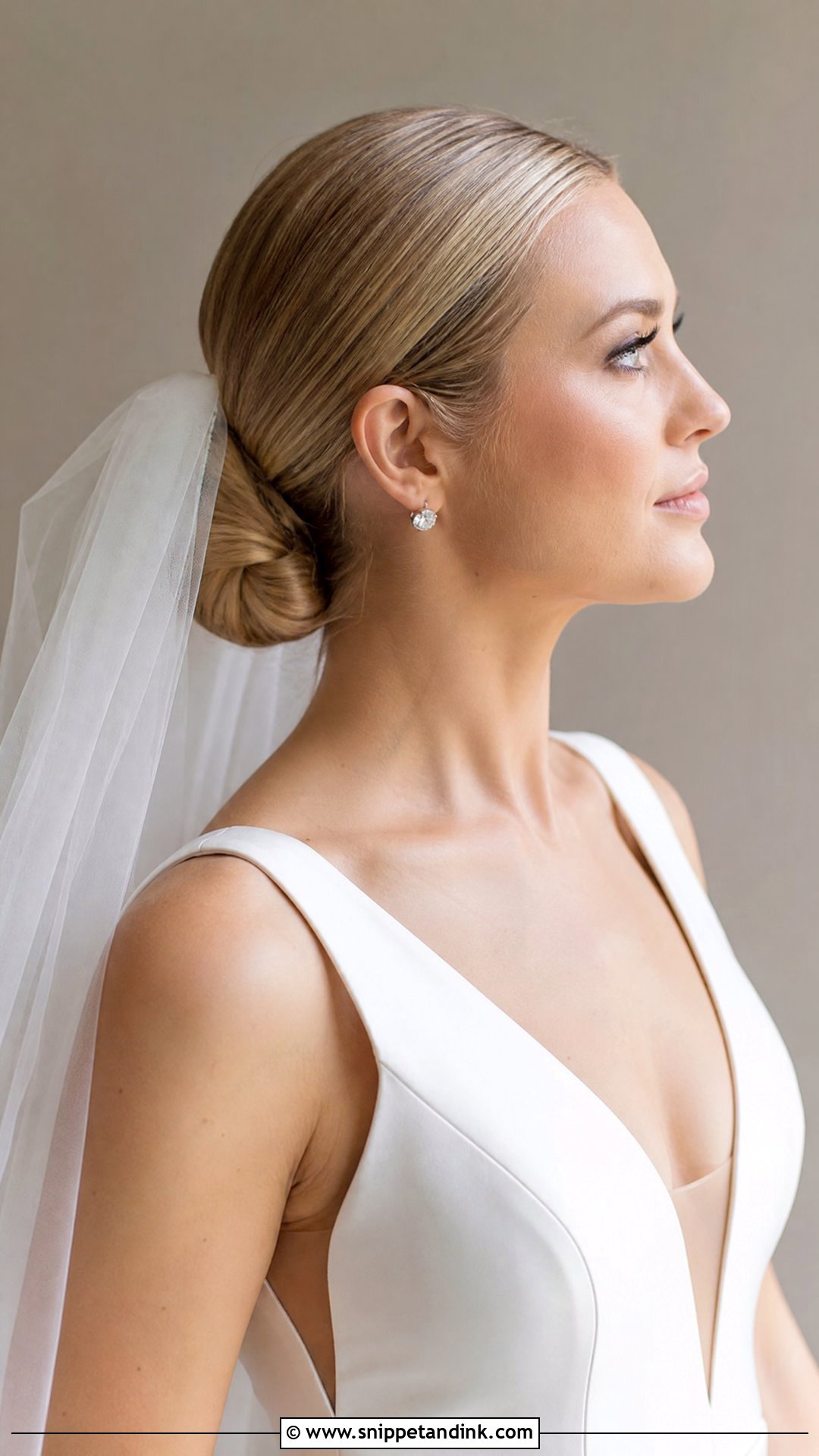 Low Bun Wedding Hair With Veil - Snippet and Ink - 15 Clean Low Bun Wedding Hair Ideas