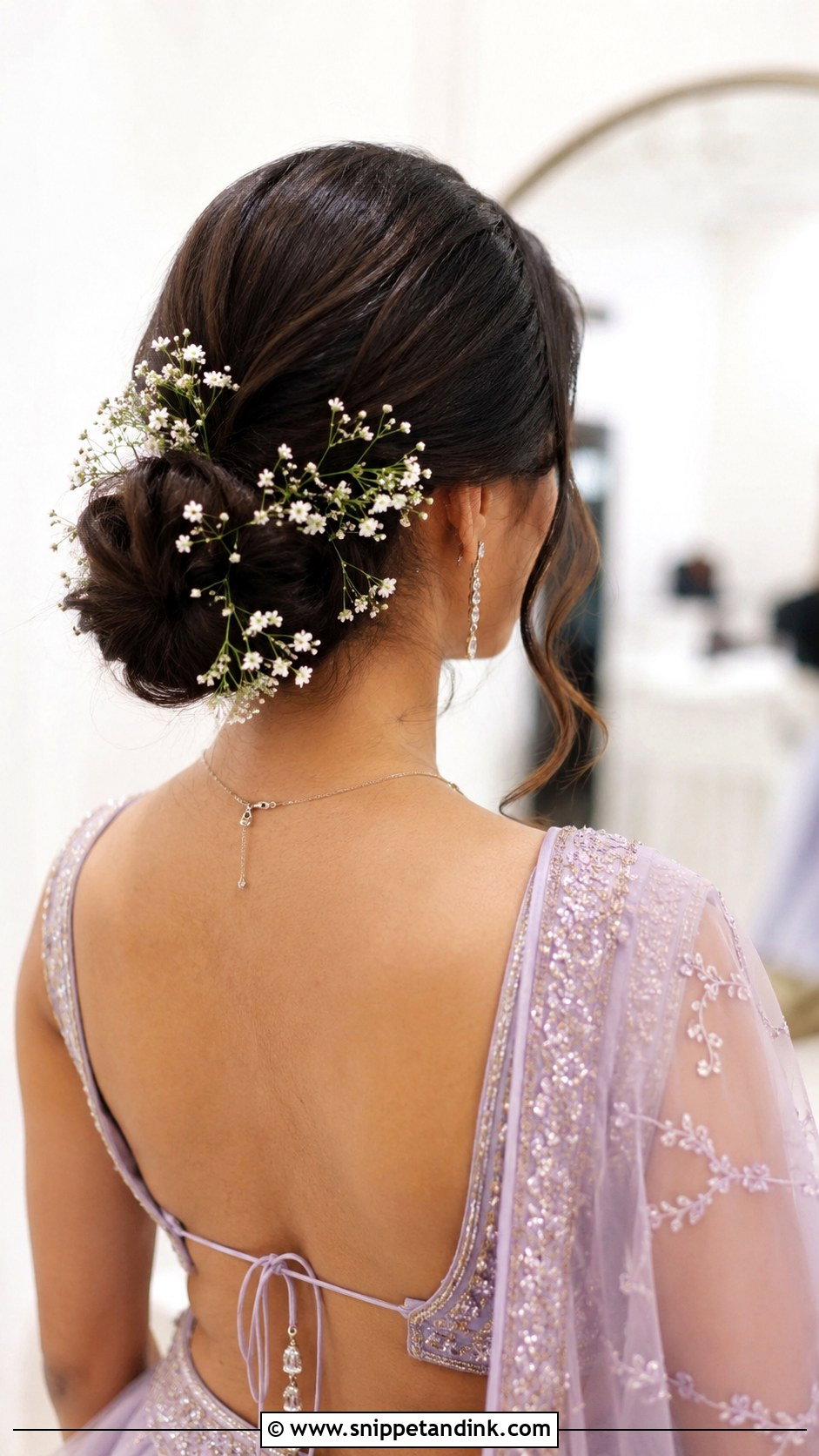 Low Bun With Babys Breath - Snippet and Ink - 20 Latest Indian Wedding Bridal Hairstyle Ideas