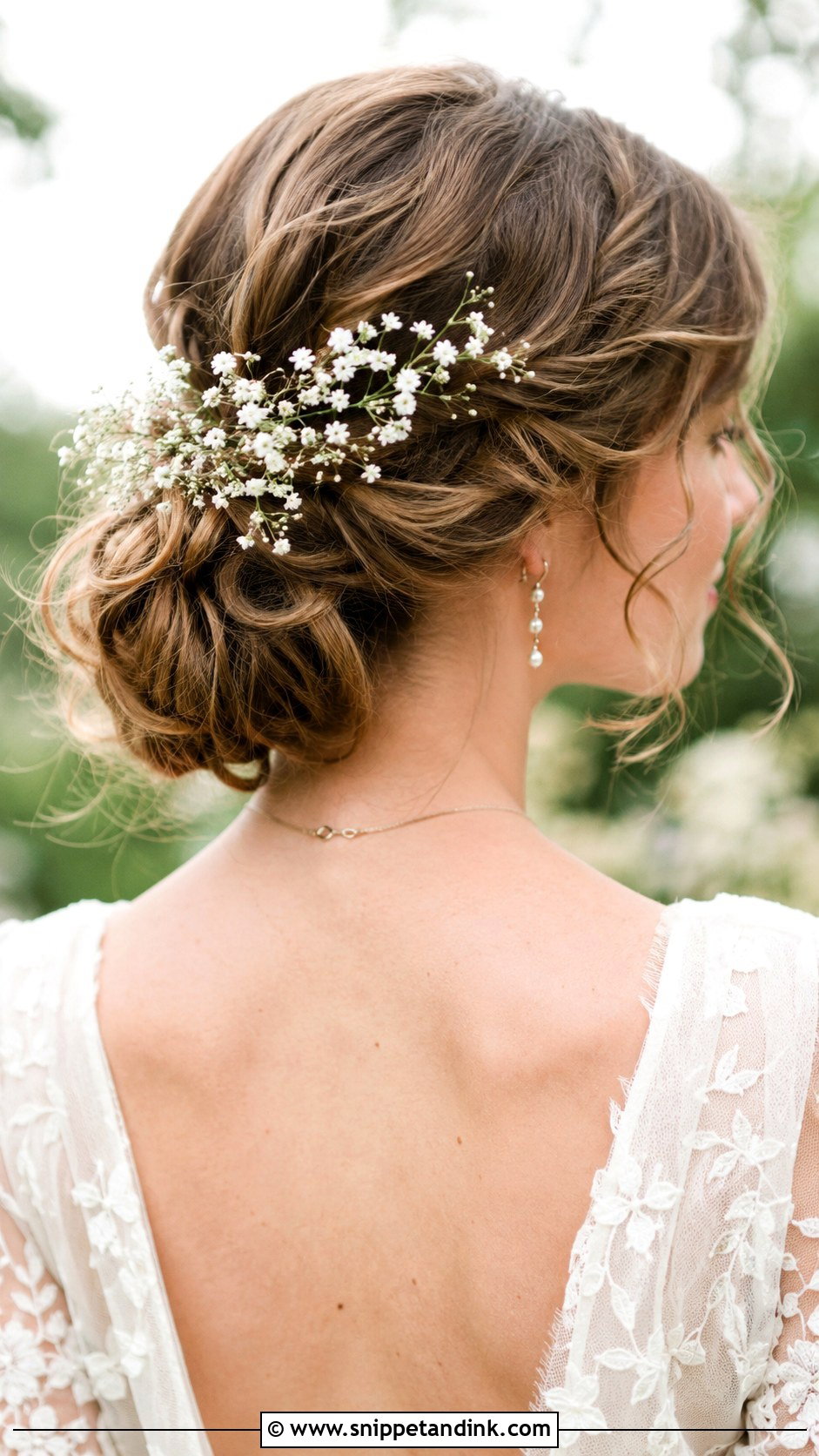 Low Bun With Babys Breath - Snippet and Ink - 20 Low Bun Wedding Guest Hair Ideas