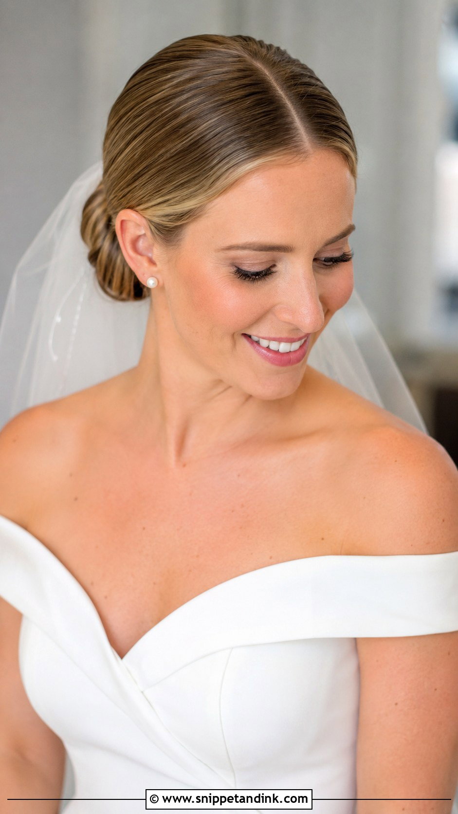 Low Bun With Center Part - Snippet and Ink - 35 Bun Hairstyles for Wedding