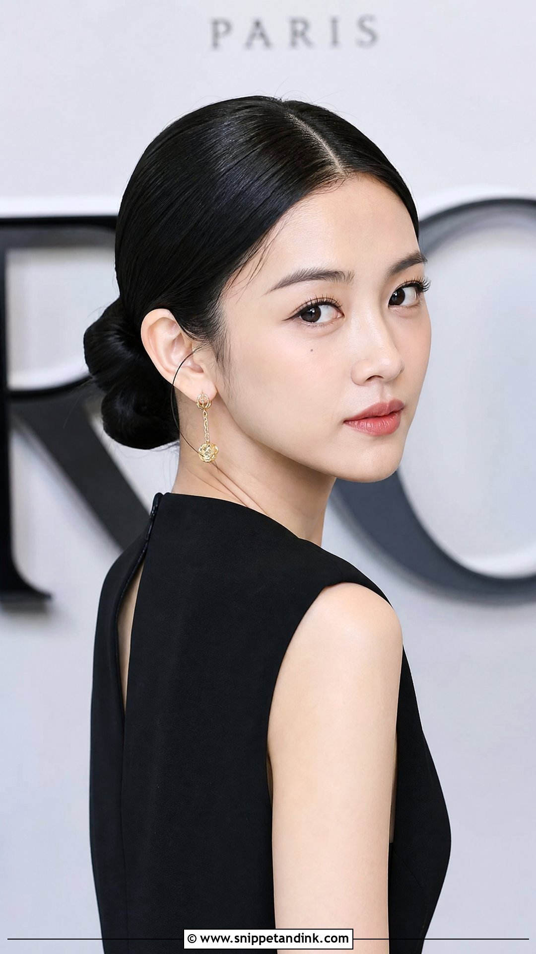 Low Bun With Center Part - Snippet and Ink - 20 Cute Wedding Guest Hairstyles