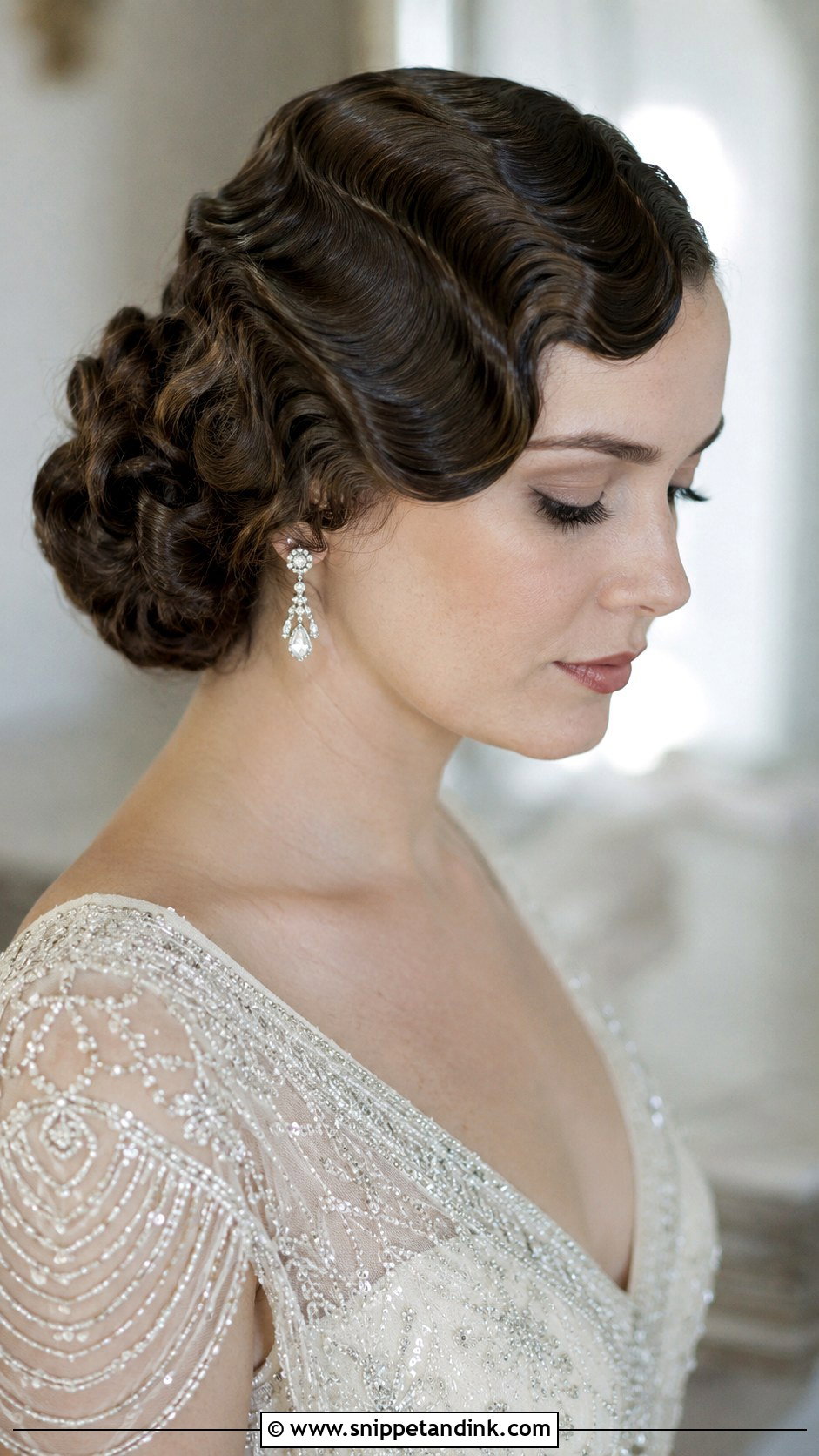 Low Bun With Center Part - Snippet and Ink - 25 Bridal Updo Hairstyles