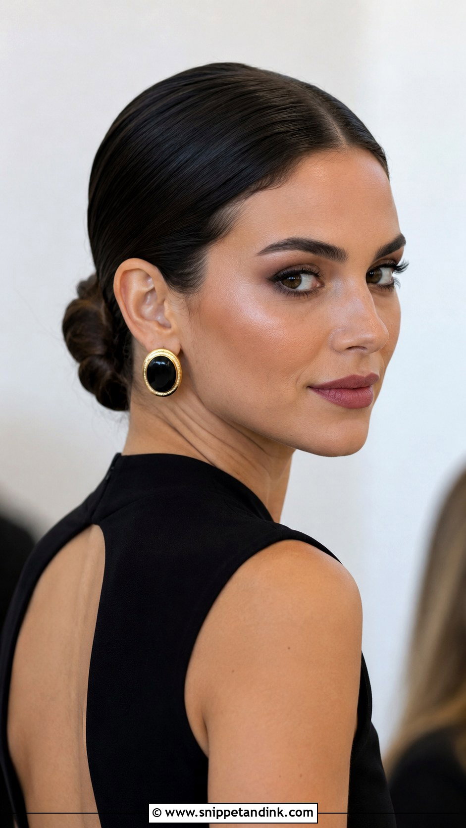 Low Bun With Center Part - Snippet and Ink - 25 Easy Medium Wedding Guest Hairstyles
