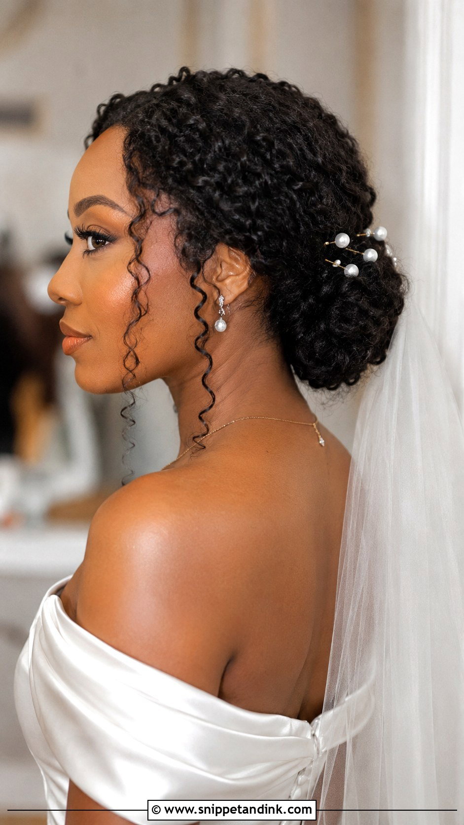 Low Bun With Curly Tendrils - Snippet and Ink - 30 Natural Hair Wedding Ideas