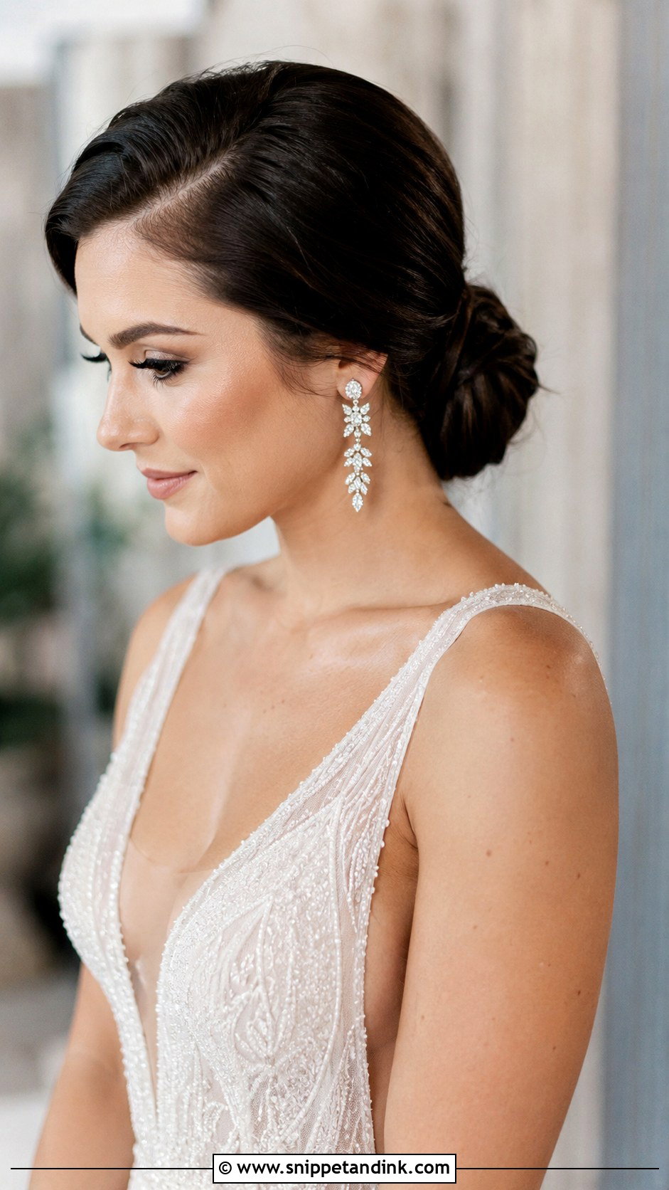 Low Bun With Deep Side Part - Snippet and Ink - 25 Loose Low Bun Wedding Hair Ideas