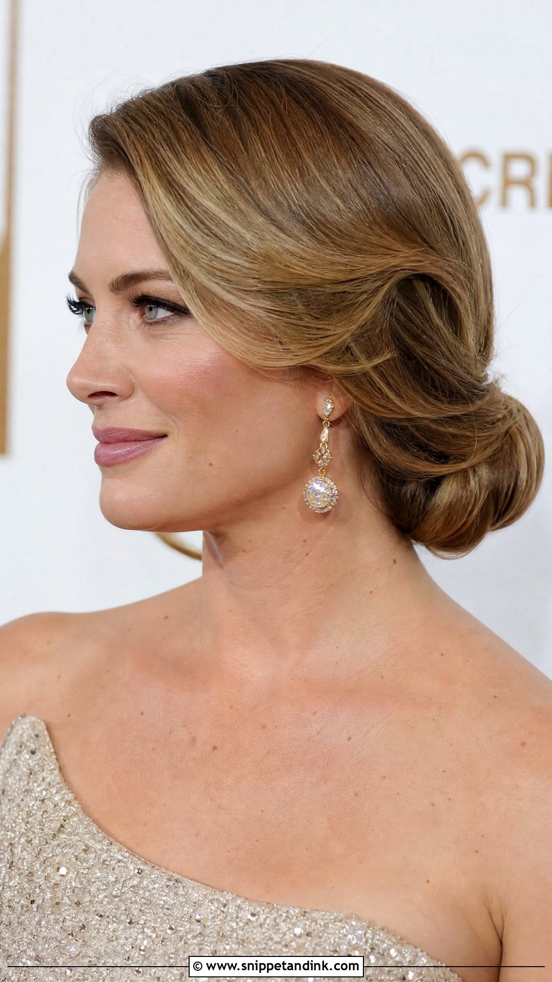 Low Bun With Deep Side Sweep - Snippet and Ink - 20 Sleek Low Bun Wedding Hair Ideas