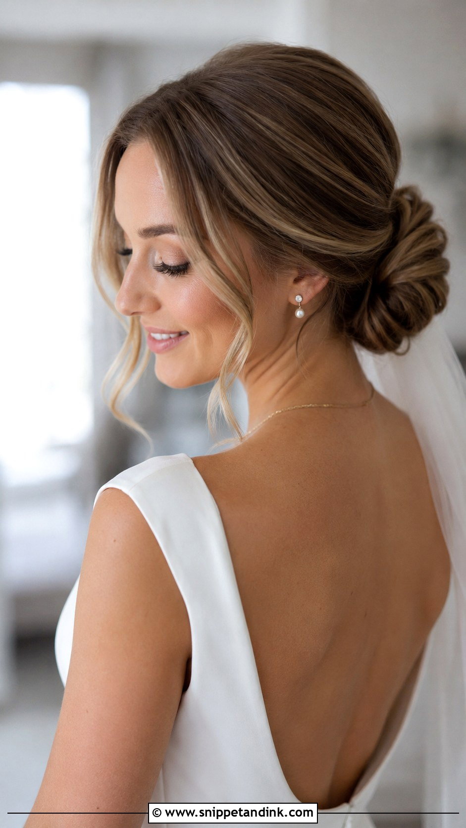 Low Bun With Face Framing Tendrils - Snippet and Ink - 30 Low Bun Bridal Hair Ideas