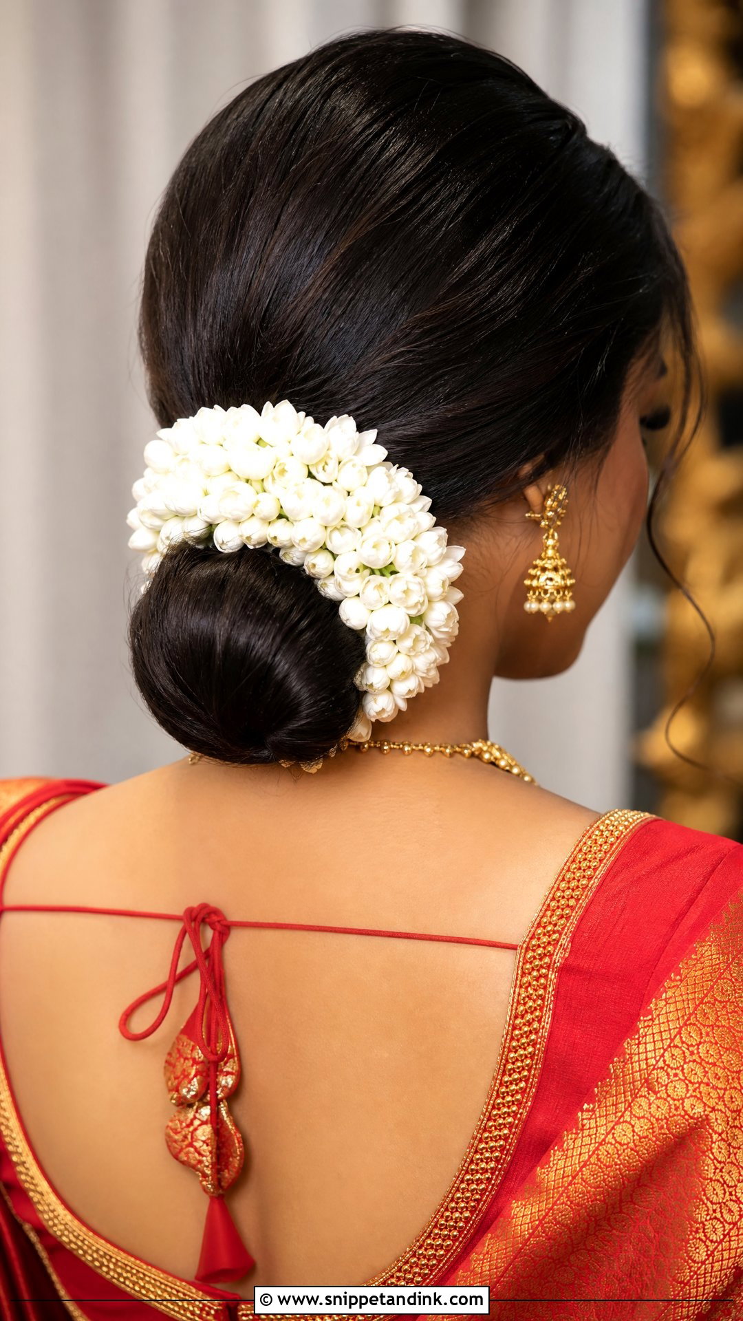 Low Bun With Gajra for Saree - Snippet and Ink - 20 Indian Wedding Bun Bridal Hairstyle Ideas