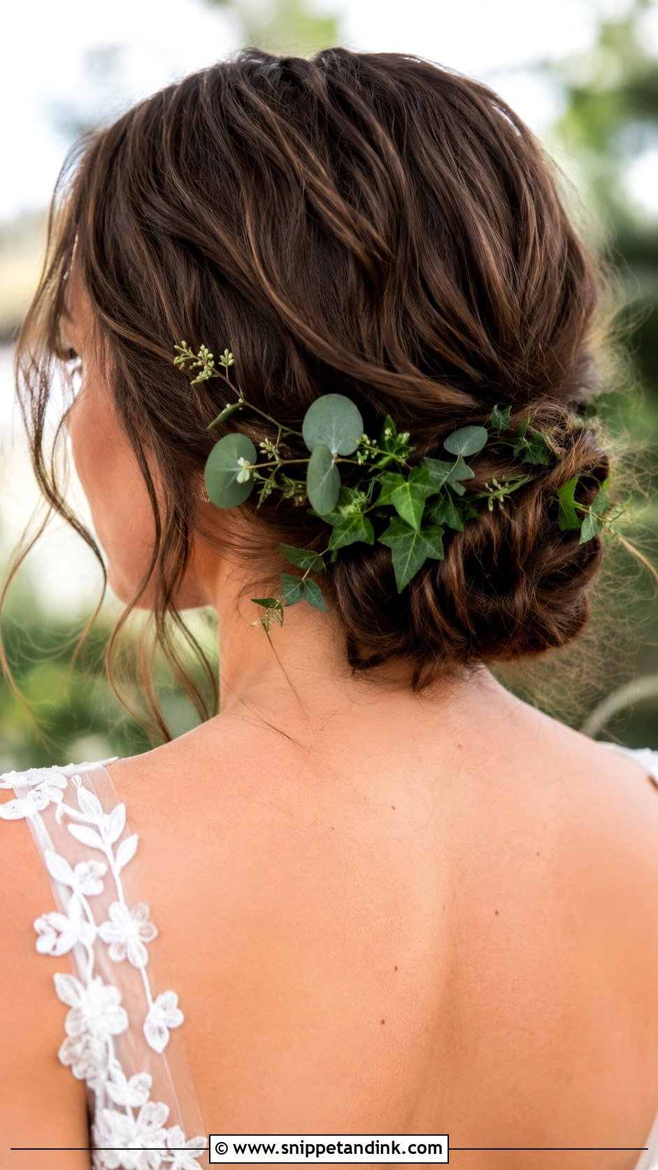 Low Bun With Greenery - Snippet and Ink - 35 Low Bun Wedding Hair Ideas