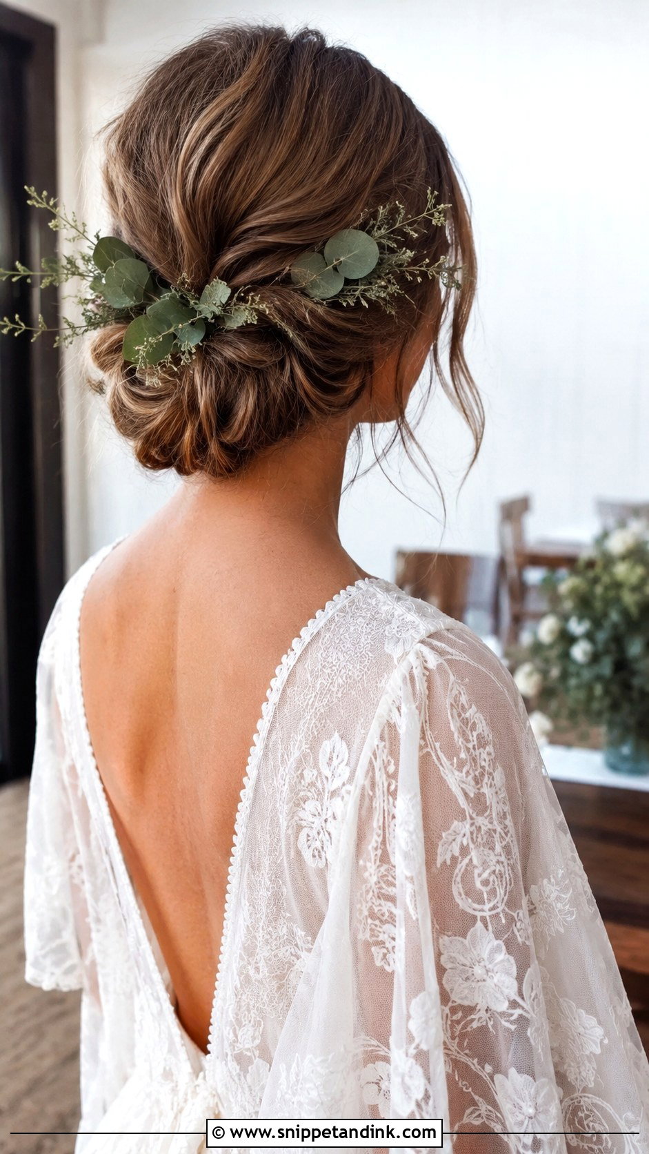 Low Bun With Greenery Accents - Snippet and Ink - 20 Low Wedding Updo Ideas