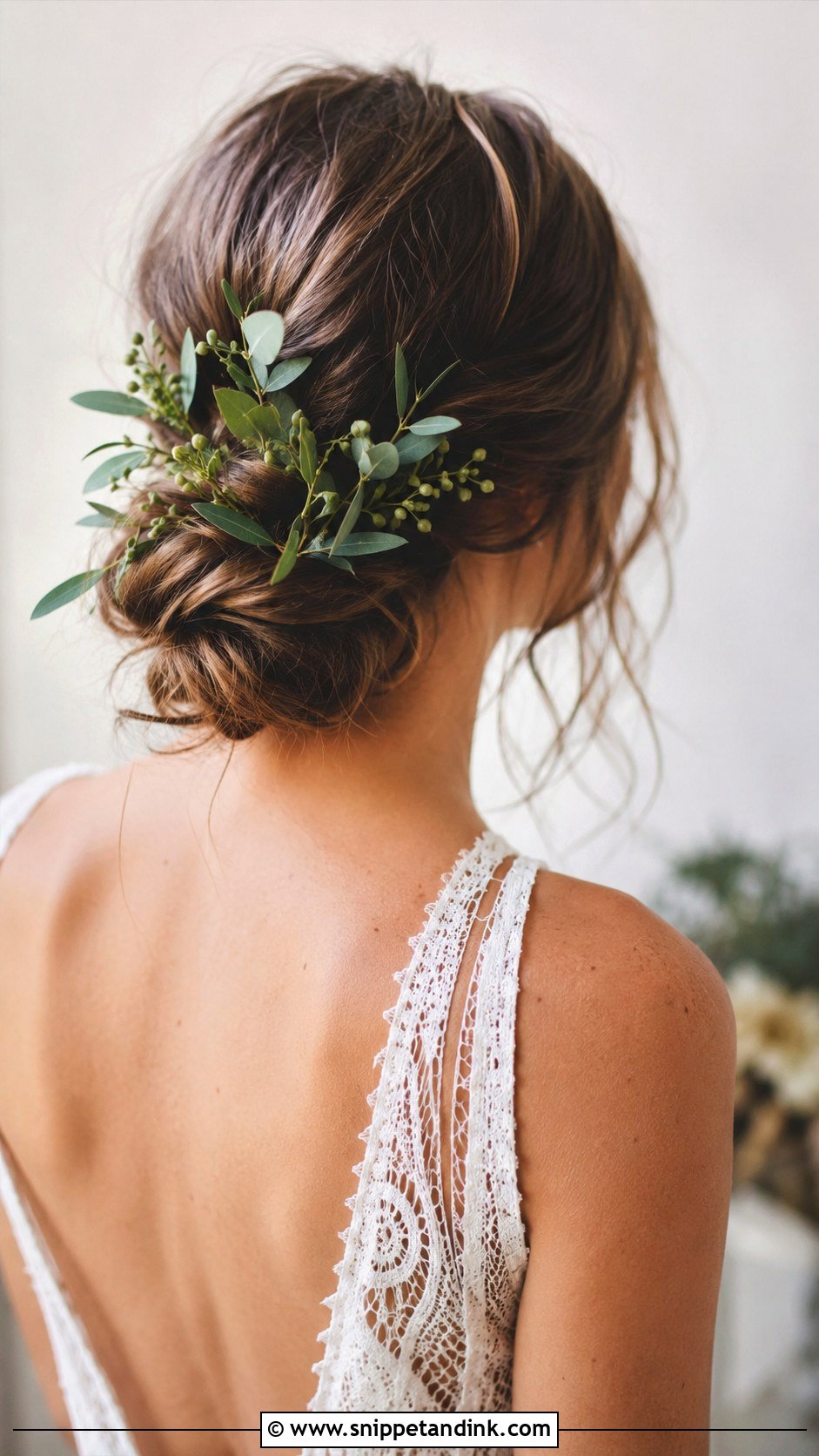 Low Bun With Greenery and Foliage - Snippet and Ink - 20 Low Loose Bun Wedding Ideas