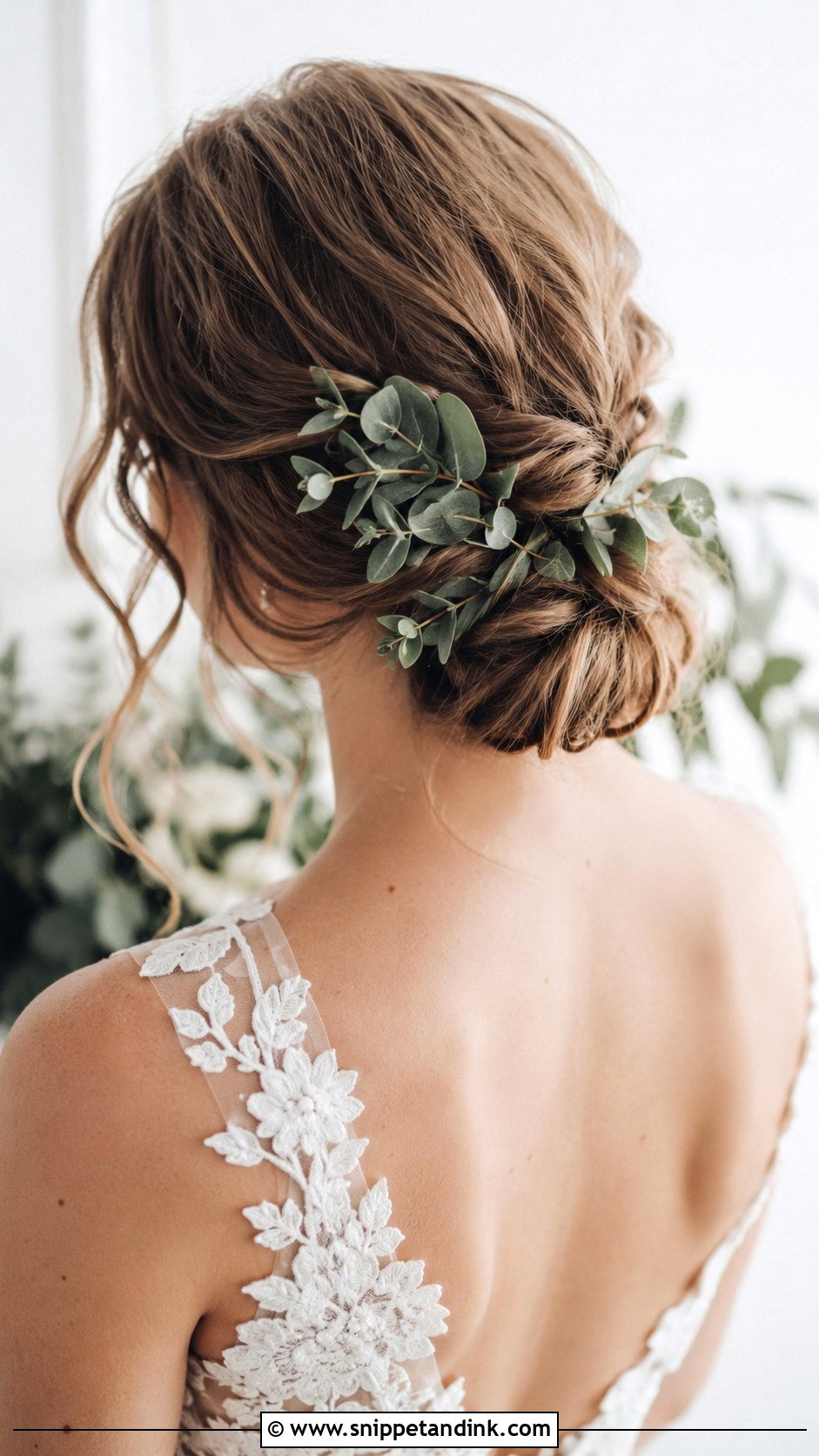 Low Bun With Greenery - Snippet and Ink - 25 Loose Low Bun Wedding Hair Ideas