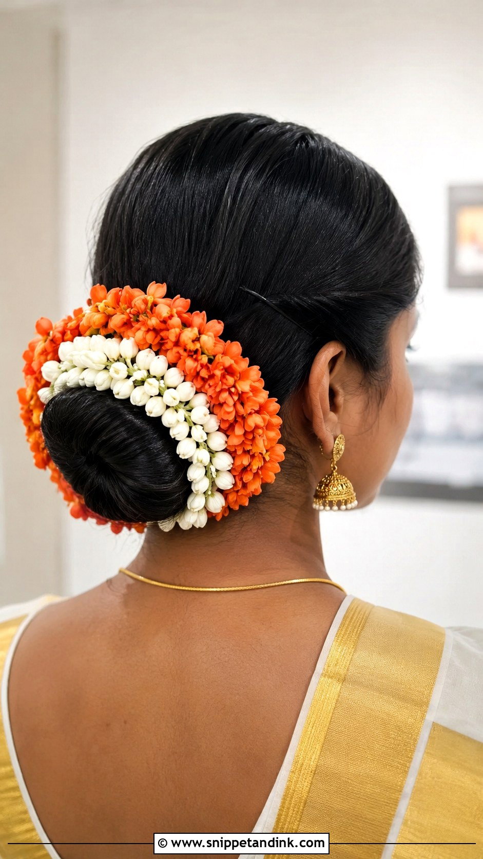Low Bun With Kanakambaram Flowers - Snippet and Ink - 25 Kerala Wedding Hairstyle Ideas