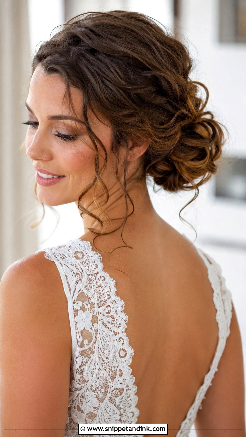 Low Bun With Loose Curls - Snippet and Ink - 35 Low Bun Wedding Hair Ideas