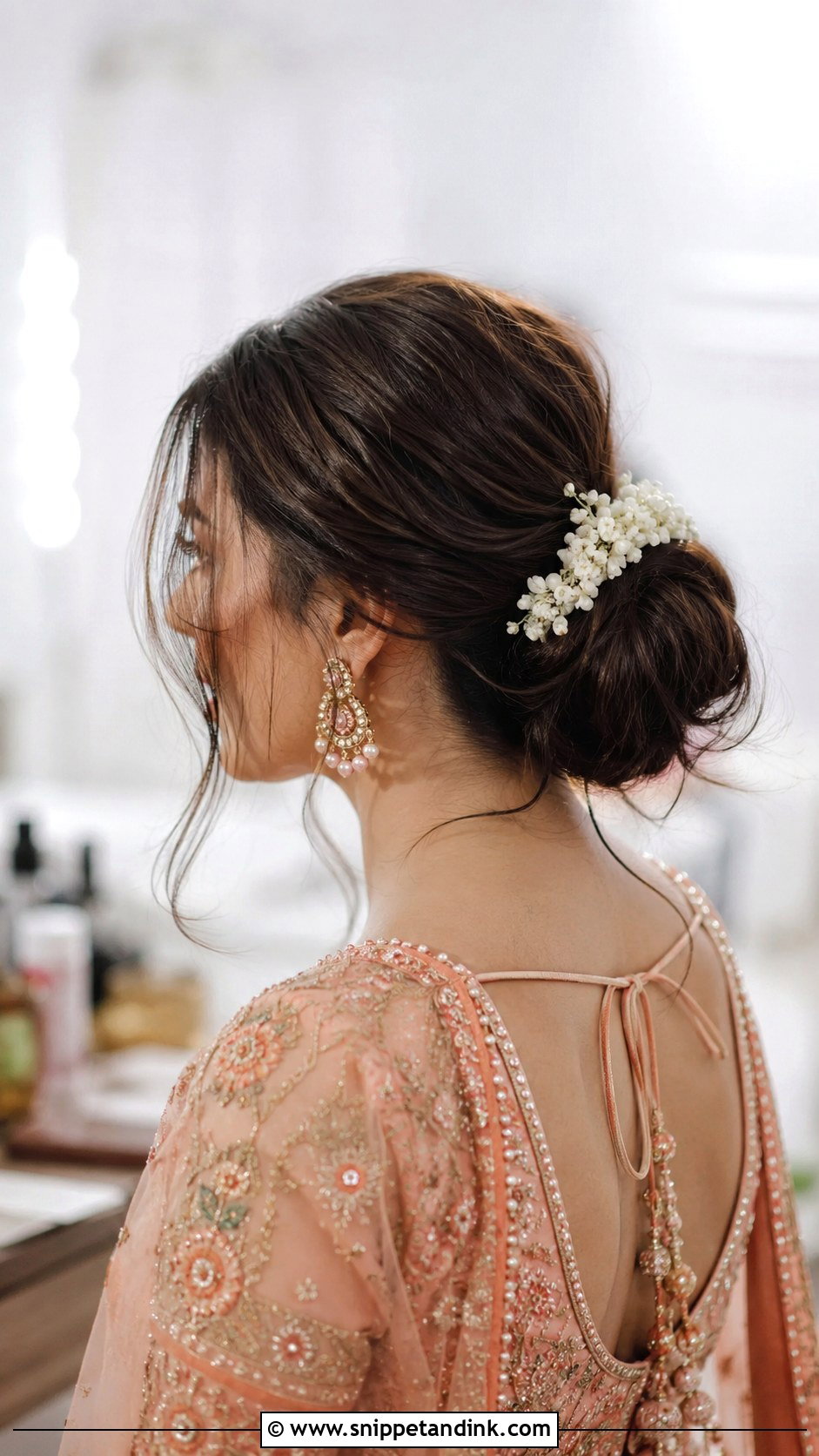 Low Bun With Loose Strands - Snippet and Ink - 25 Shaadi Hairstyles