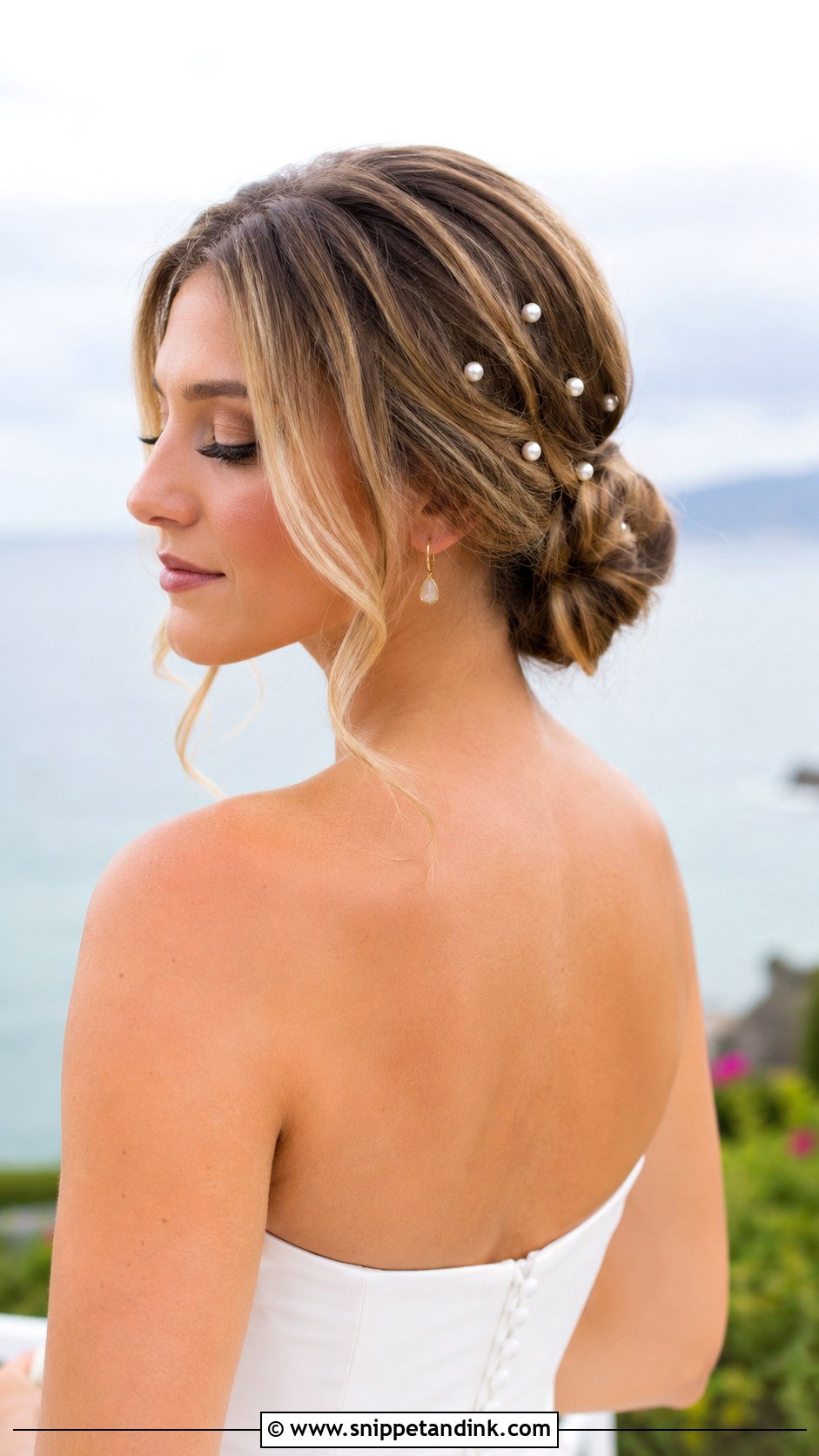 Low Bun With Loose Tendrils - Snippet and Ink - 30 Beach Wedding Hair Ideas