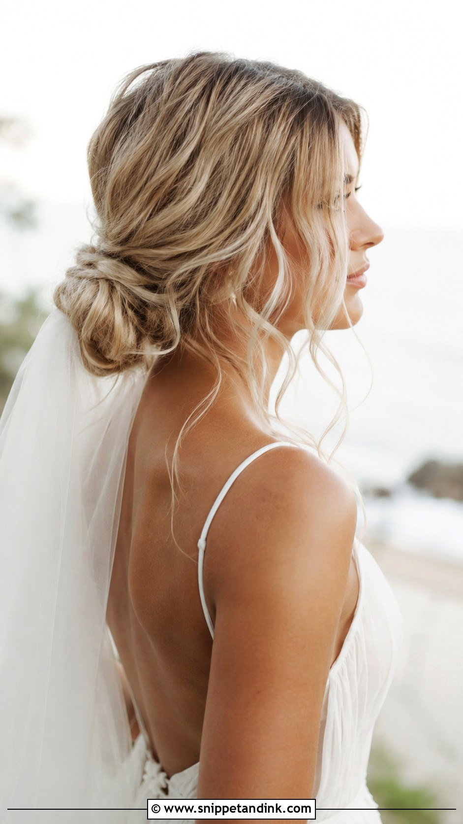 Low Bun With Loose Waves - Snippet and Ink - 30 Low Updo Wedding Hair Ideas