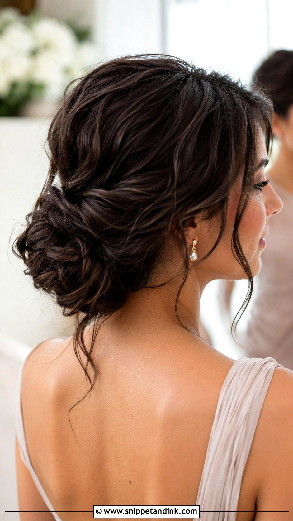 Low Bun With Loose Waves - Snippet and Ink - 20 Bridesmaid Low Bun Hairstyles