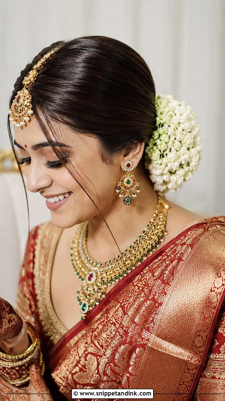 Low Bun With Maang Tikka And Flowers - Snippet and Ink - 25 Bridal Juda Hairstyles with Flowers