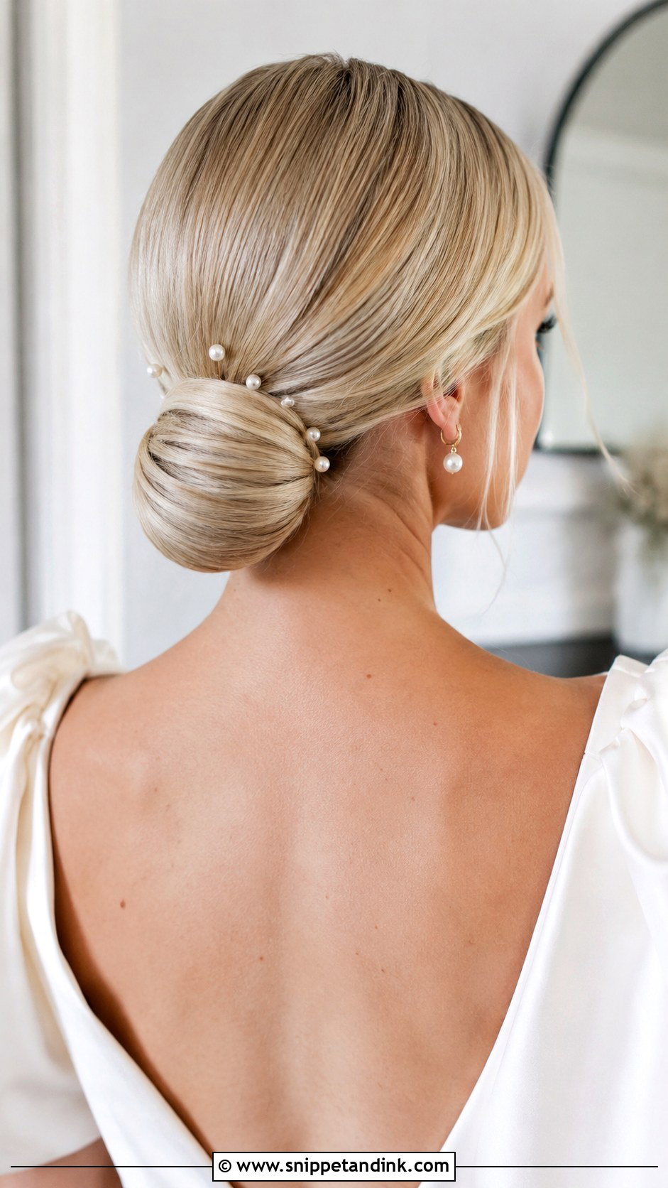 Low Bun With Pearl Pins - Snippet and Ink - 20 Wedding Hairstyles with Pearls