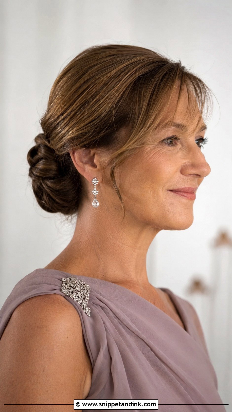 Low Bun With Side Bangs - Snippet and Ink - 20 Mother of the Bride Wedding Hairstyles