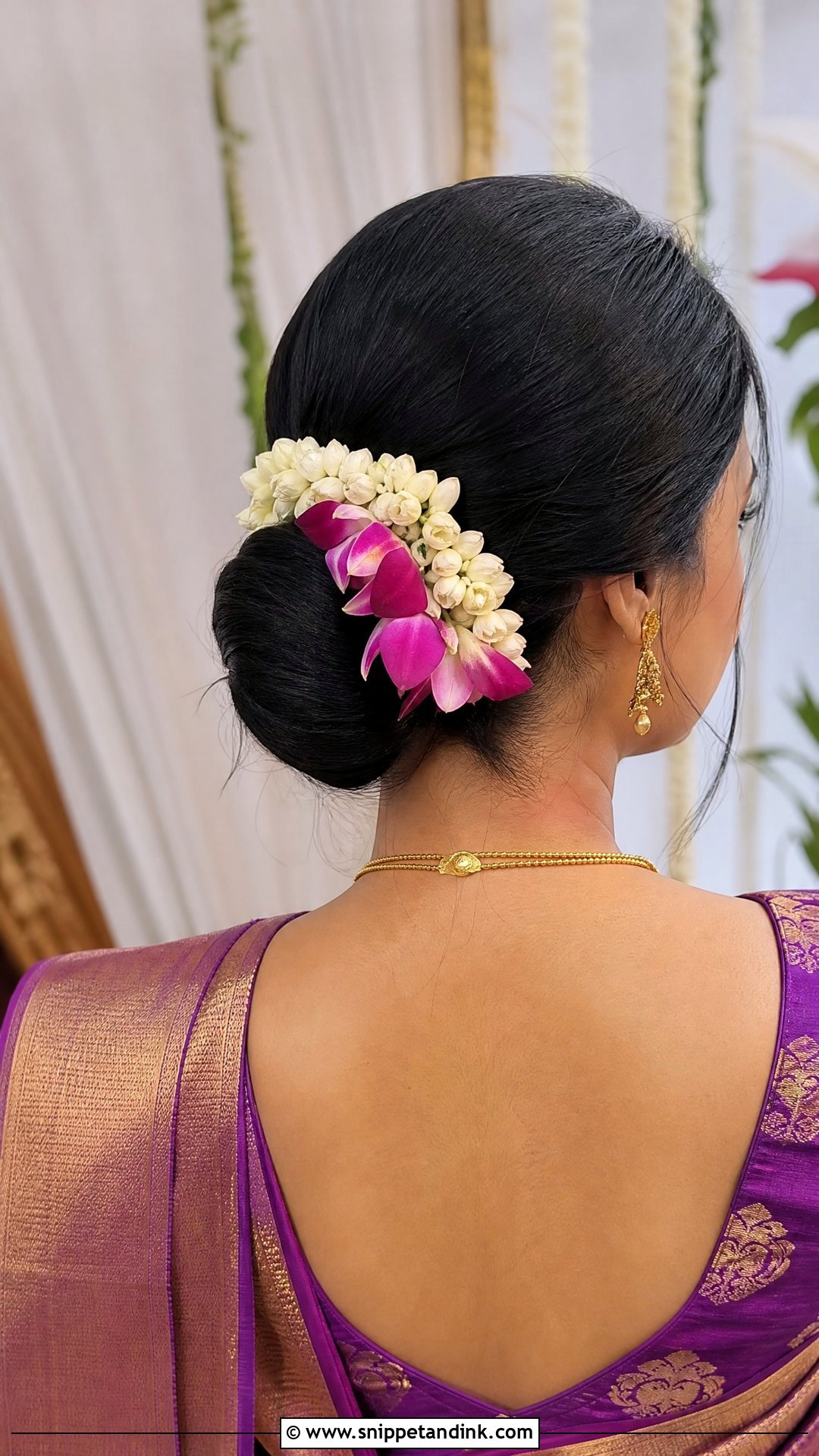 Low Bun With Side Flowers - Snippet and Ink - 20 Indian Wedding Bun Hairstyle Ideas