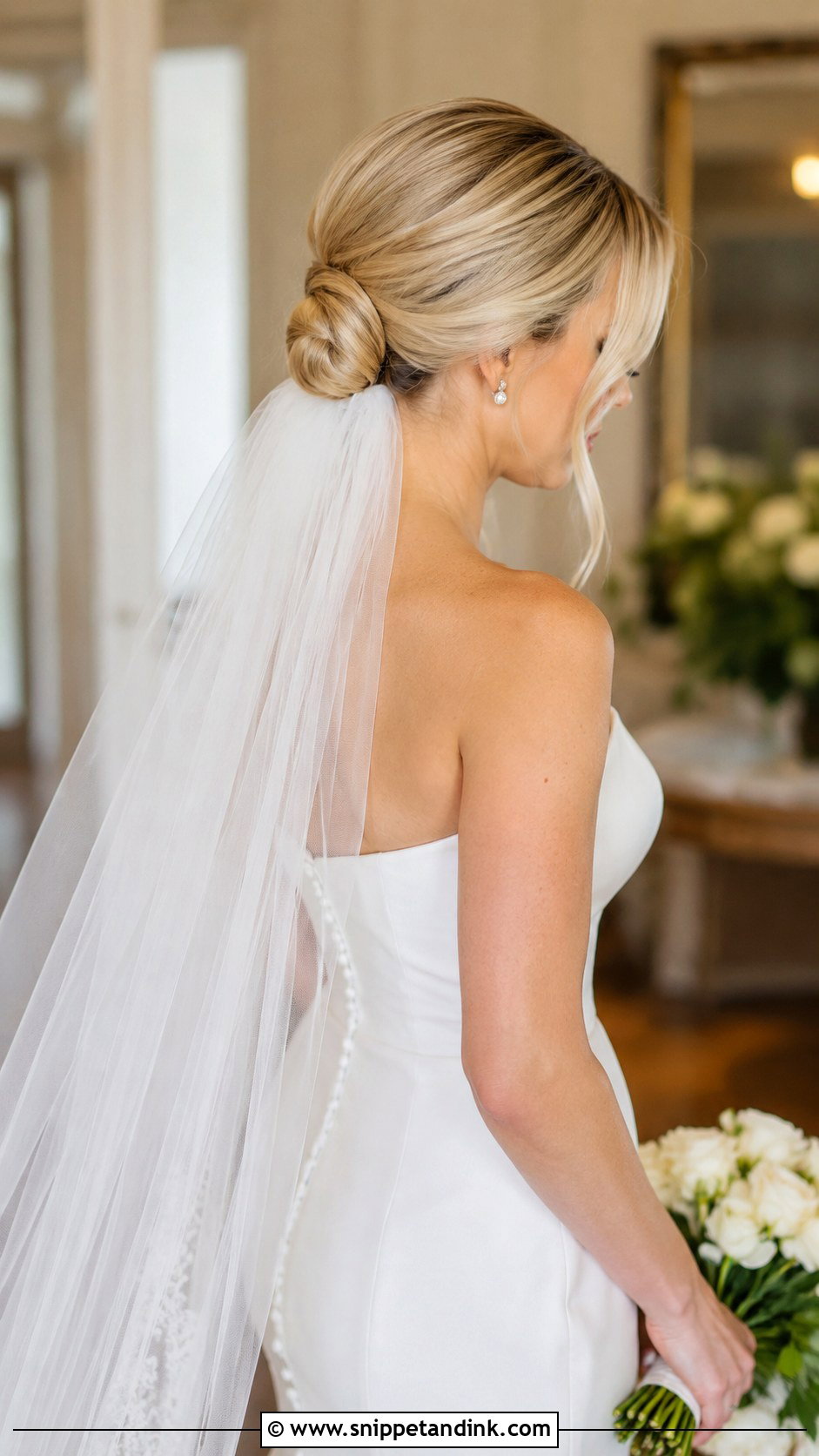 Low Bun With Veil - Snippet and Ink - 35 Bun Hairstyles for Wedding