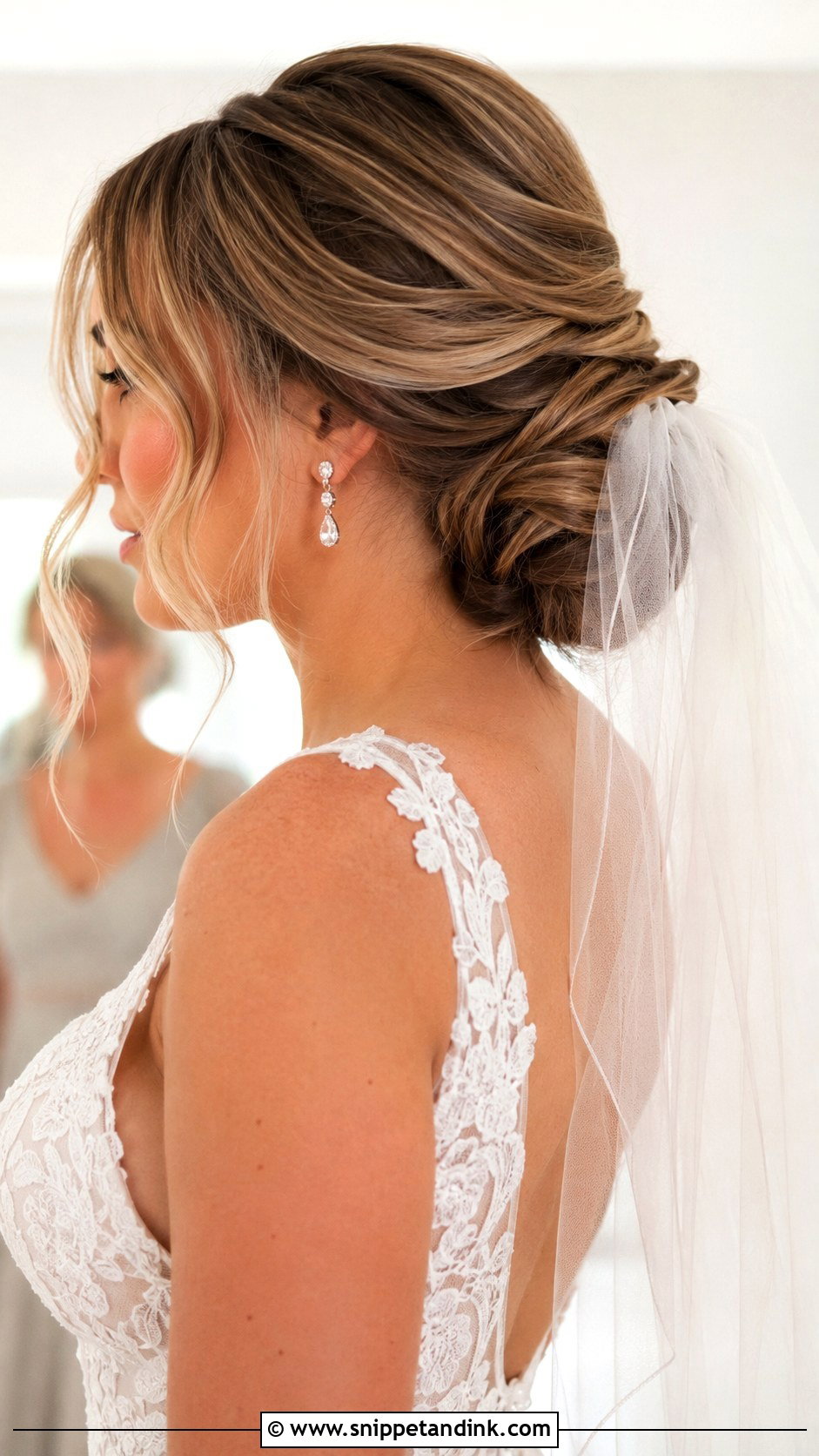 Low Bun With Veil - Snippet and Ink - 25 Loose Bun Wedding Hair Ideas