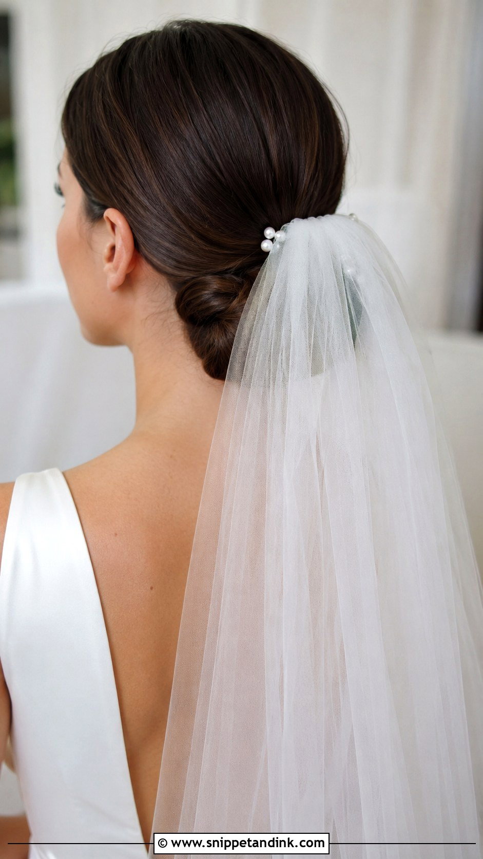 Low Bun With Veil - Snippet and Ink - 25 Wedding Bun Hairstyle Ideas