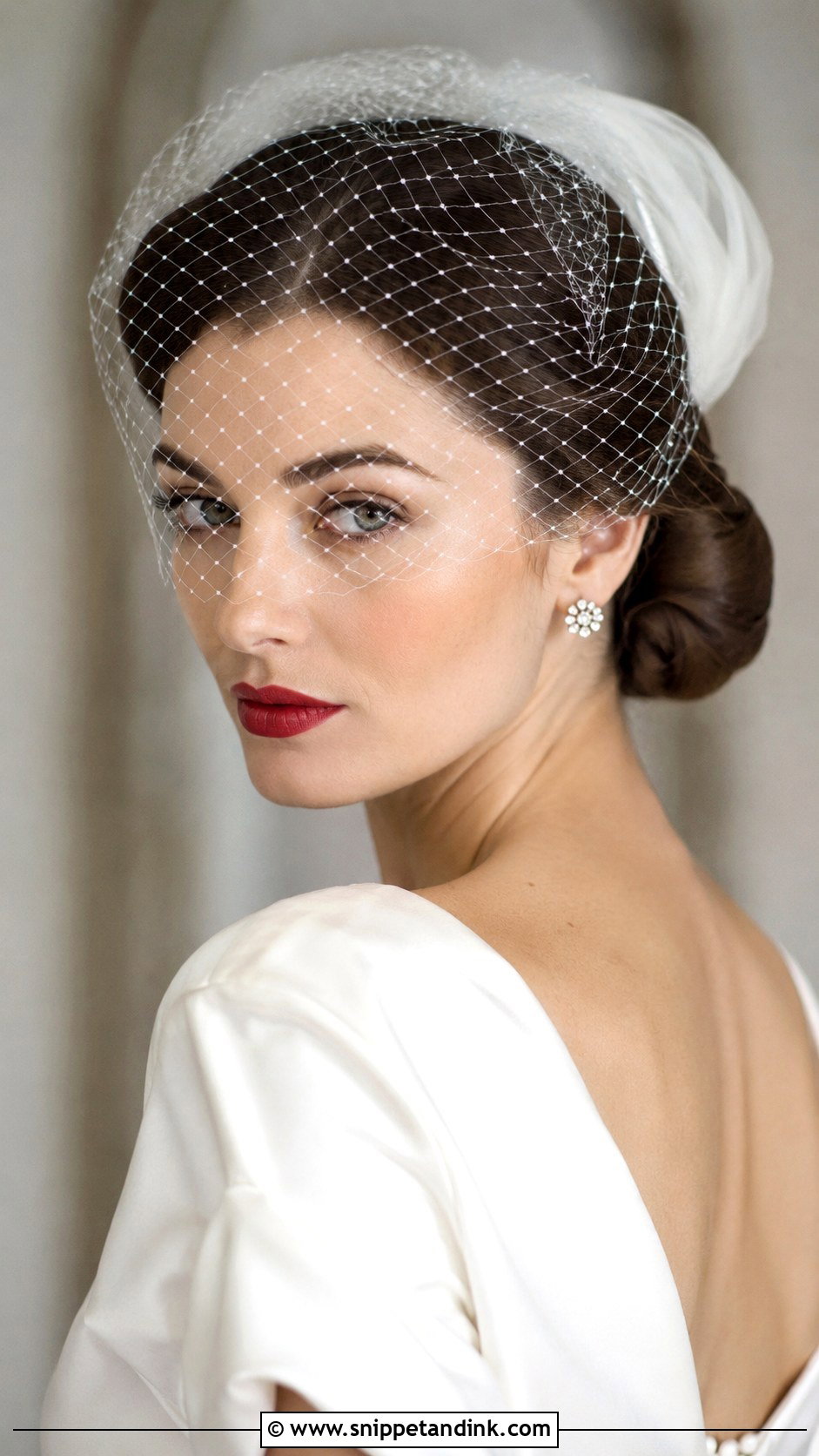 Low Bun With a Birdcage Veil - Snippet and Ink - 25 Simple Low Bun Wedding Hair Ideas