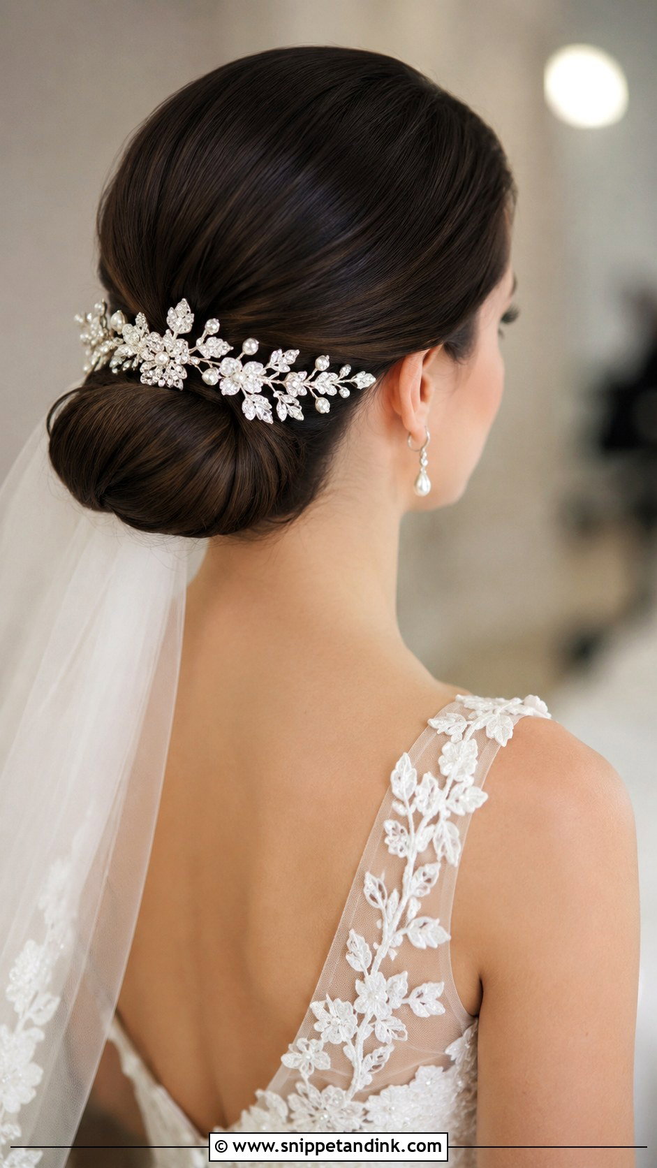 Low Bun with Floral Comb - Snippet and Ink - 25 Summer Wedding Hairstyles