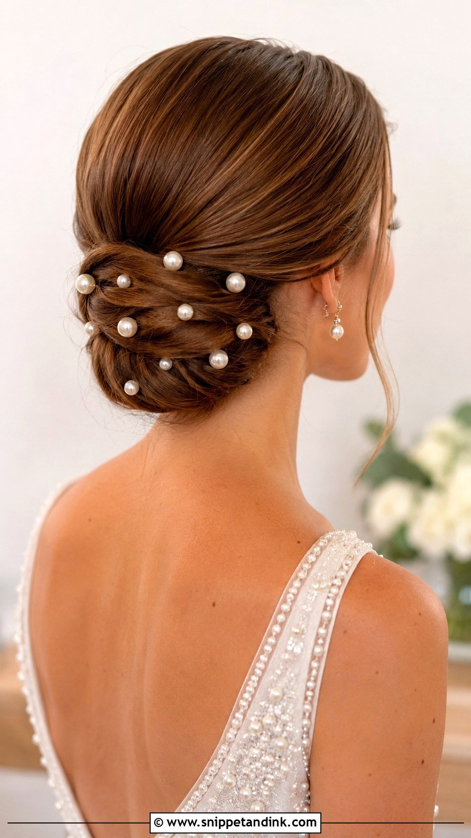 Low Chignon With Pearl Pins - Snippet and Ink - 25 Loose Low Bun Wedding Hair Ideas