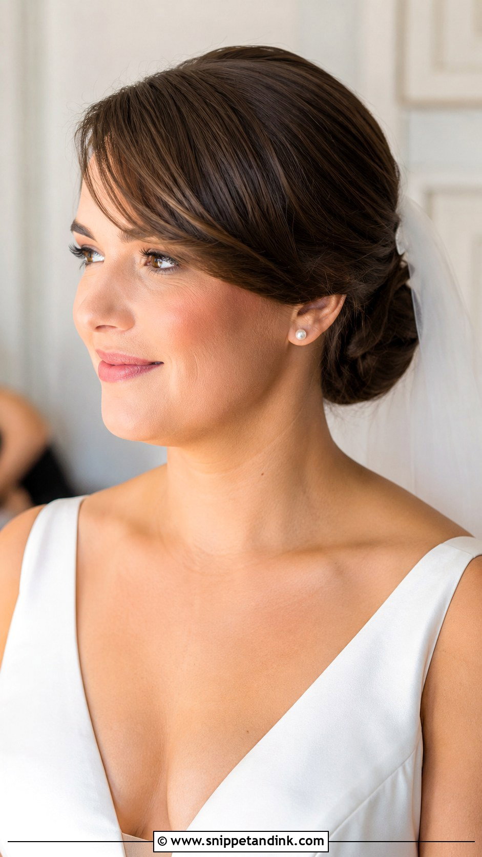Low Chignon With Side Swept Bangs - Snippet and Ink - 25 Round Face Hairstyles for Wedding