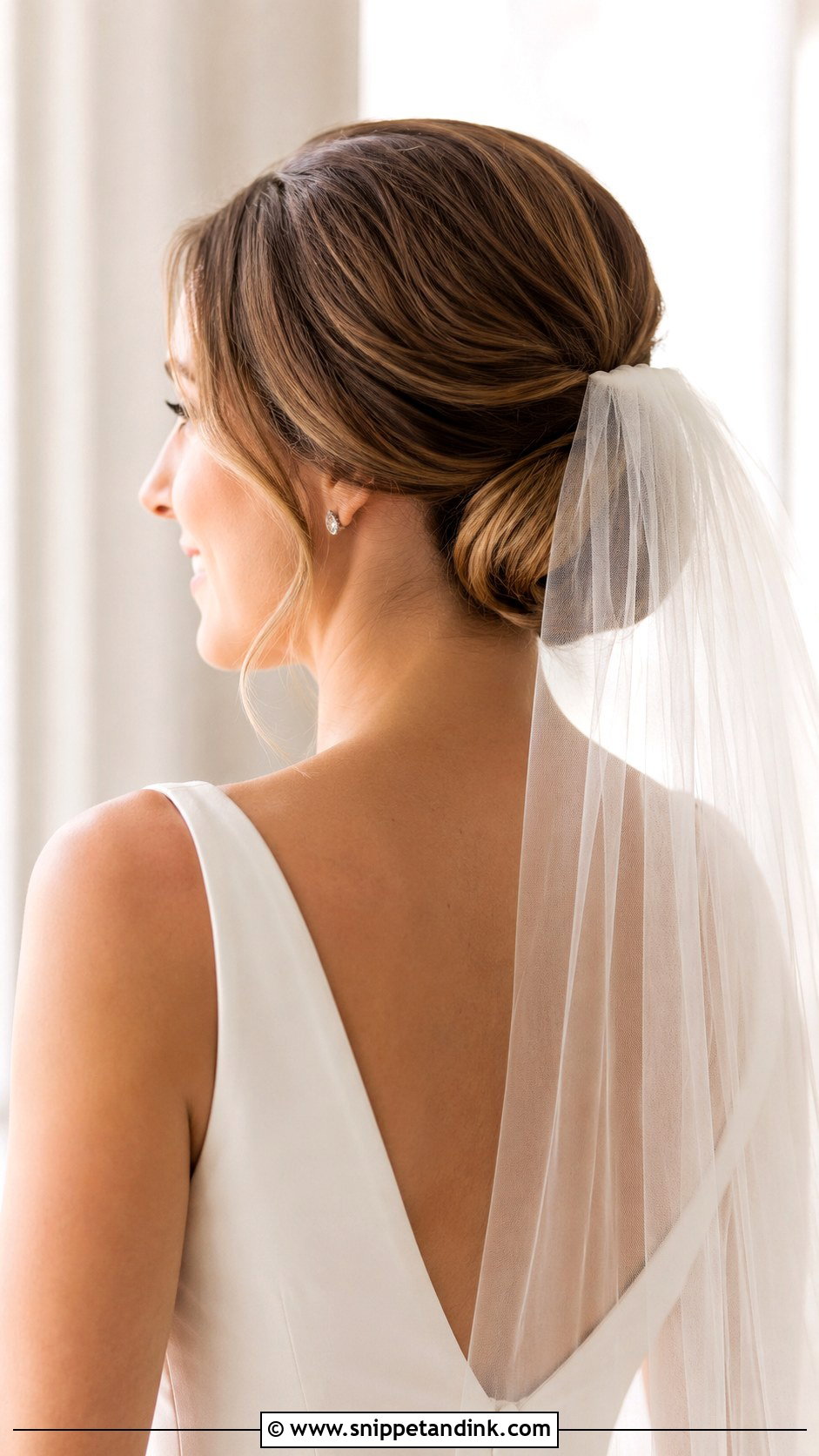 Low Chignon with Veil - Snippet and Ink - 25 Wedding Updos for Medium Length Hair